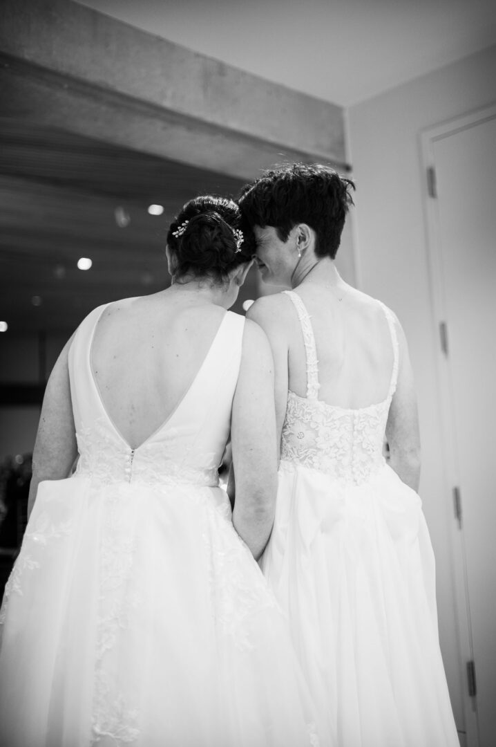 Winter Wedding at Botanical Gardens, San Antonio, Texas 40 Two brides in elegant wedding dresses.