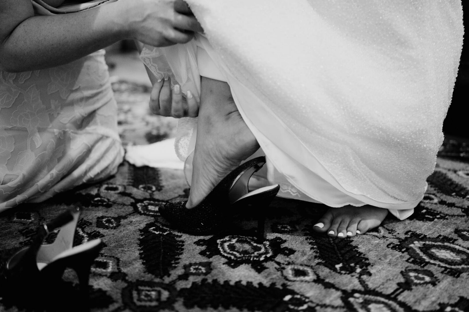Vibrant Spring Wedding at Shiraz Gardens in Bastrop 4 Black and white wedding detail of the bride’s shoes beneath her dress at Shiraz Gardens in Bastrop, Texas.