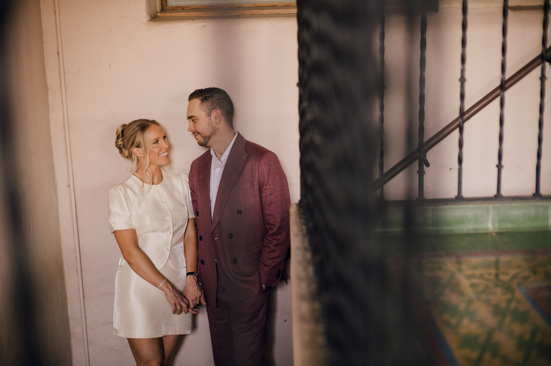 McNay Art Museum Couple posing in elegant attire indoors.