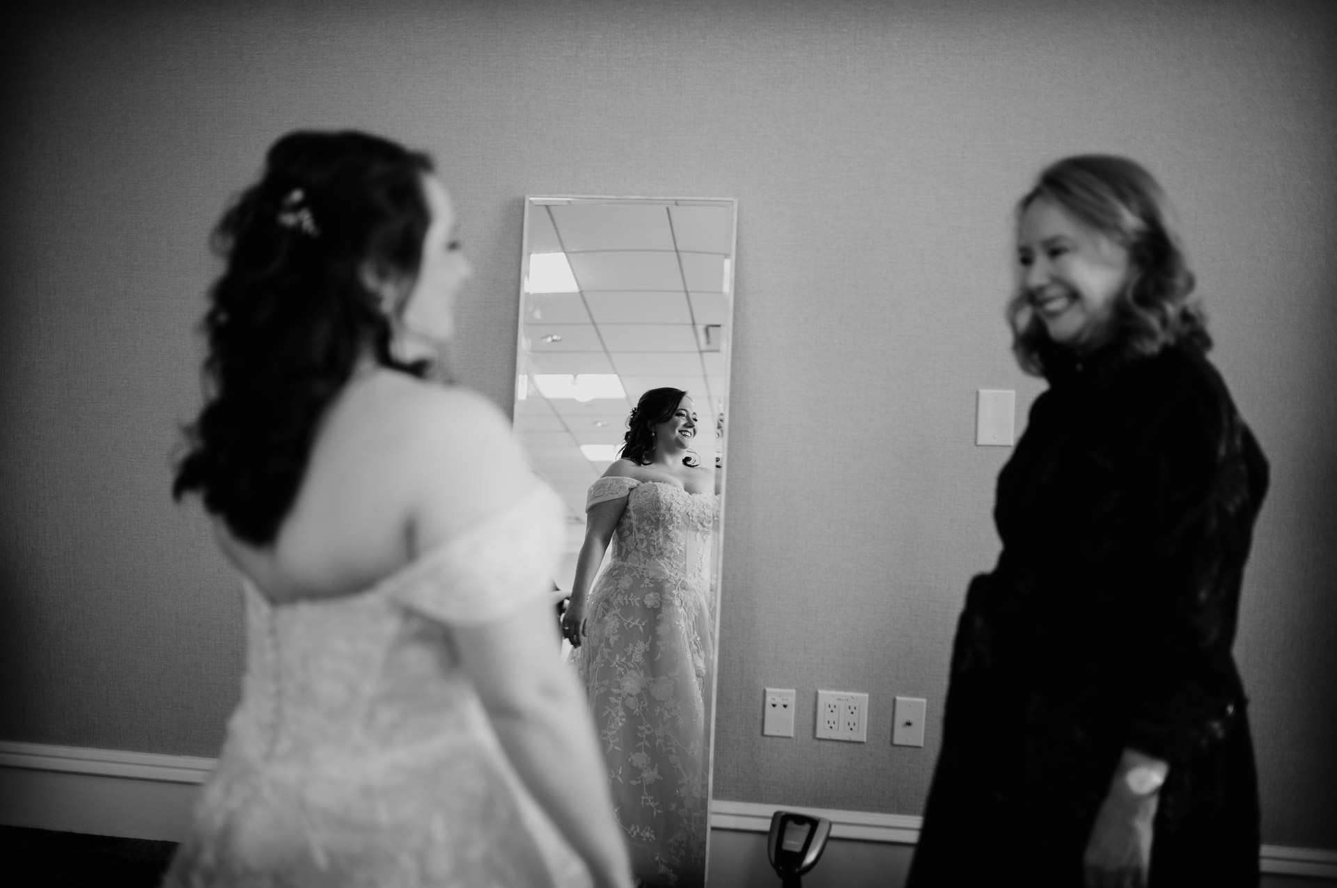 Oak Tree Ceremony & Candlelit Reception at The Houstonian 5 Bride having her dress adjusted during getting ready at The Houstonian Hotel.
