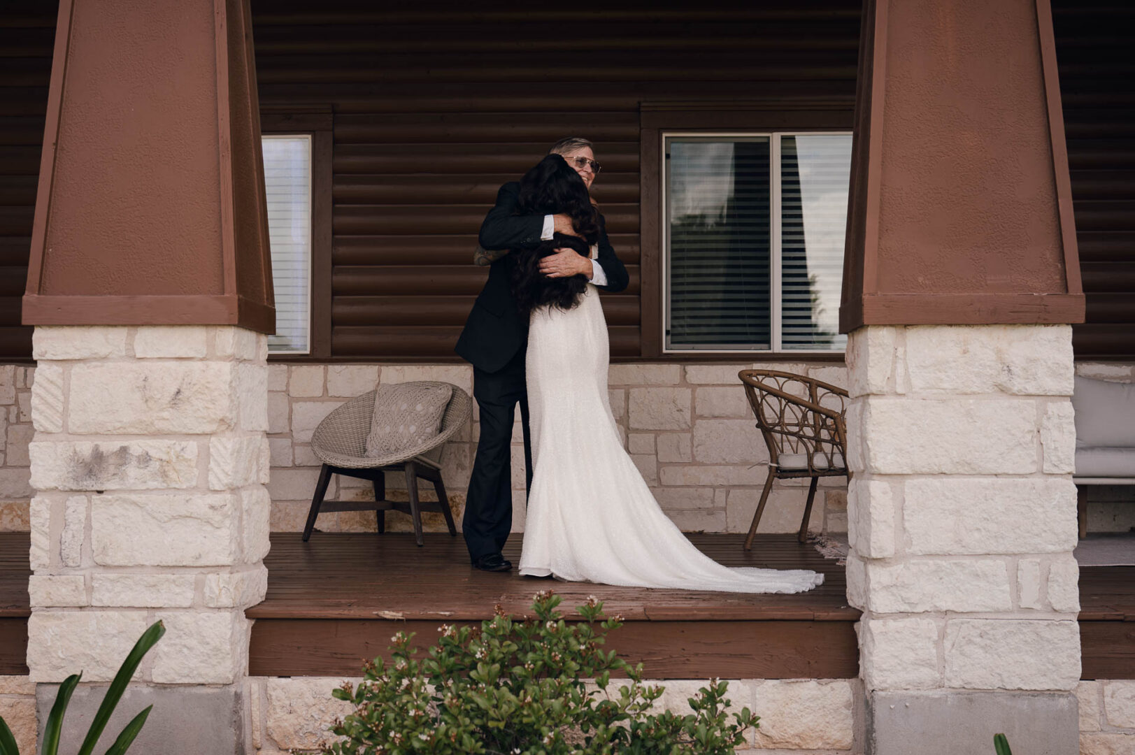 Vibrant Spring Wedding at Shiraz Gardens in Bastrop 9 Documentary wedding first look with dad standing outside the venue at Shiraz Gardens in Bastrop, Texas