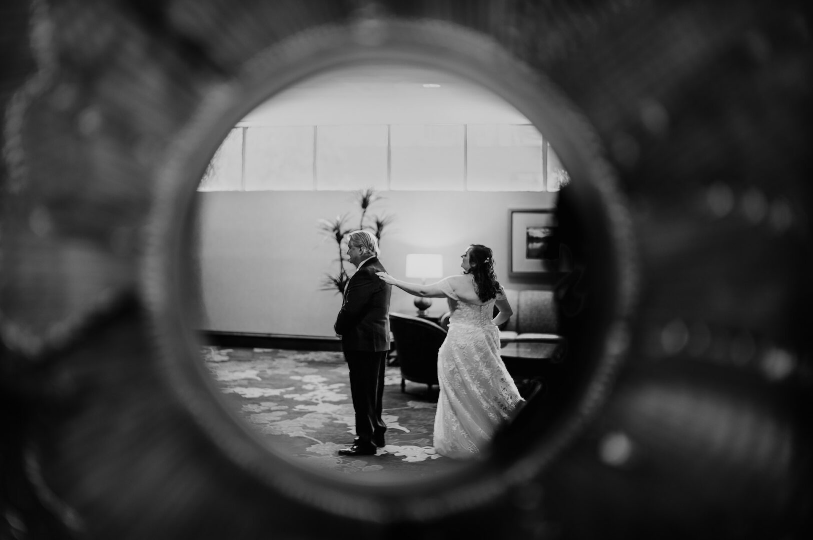 Bride taps father on the shoulder for first look
