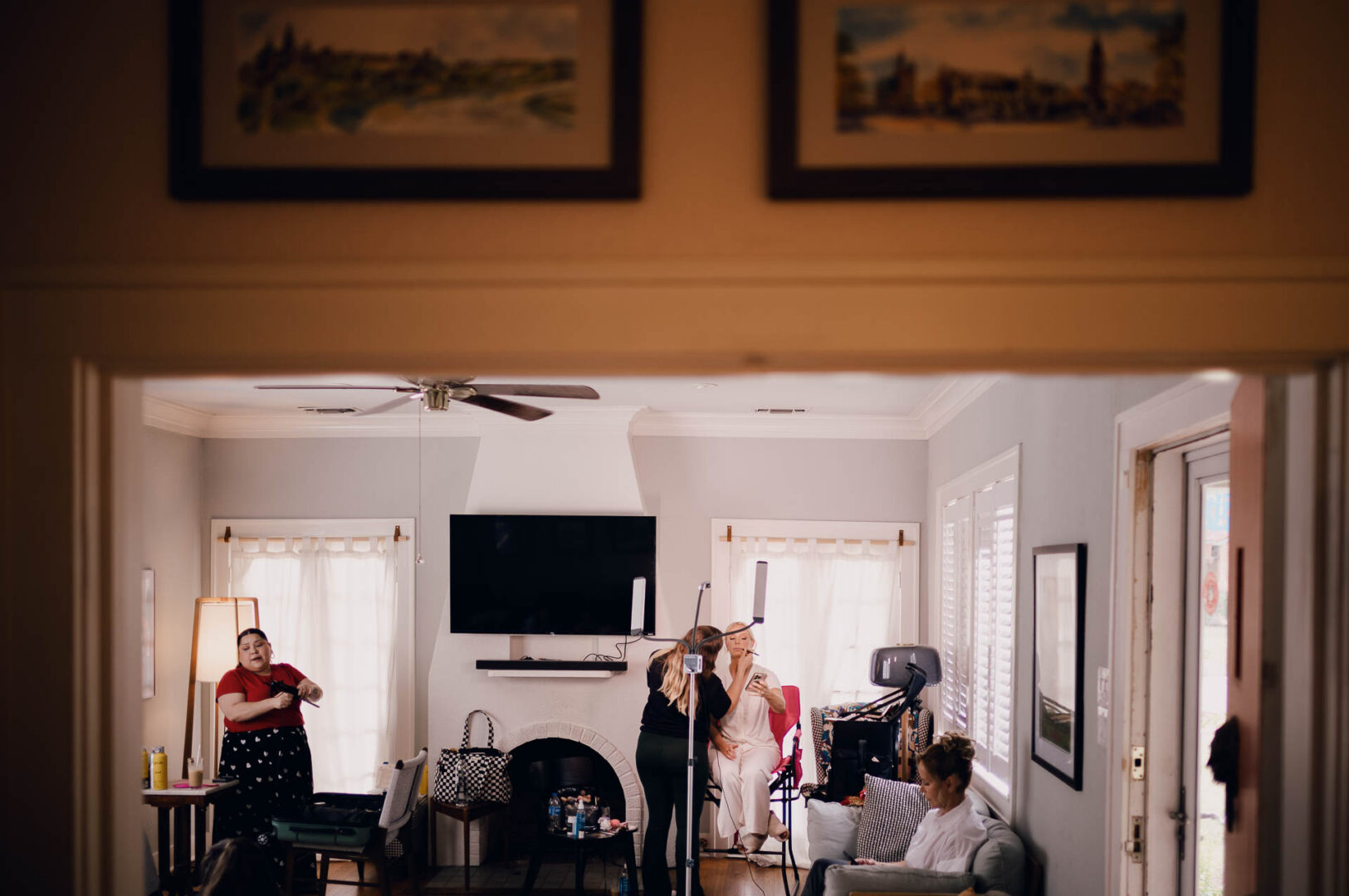 Candid indoor scene of family and guests gathering before the wedding ceremony.