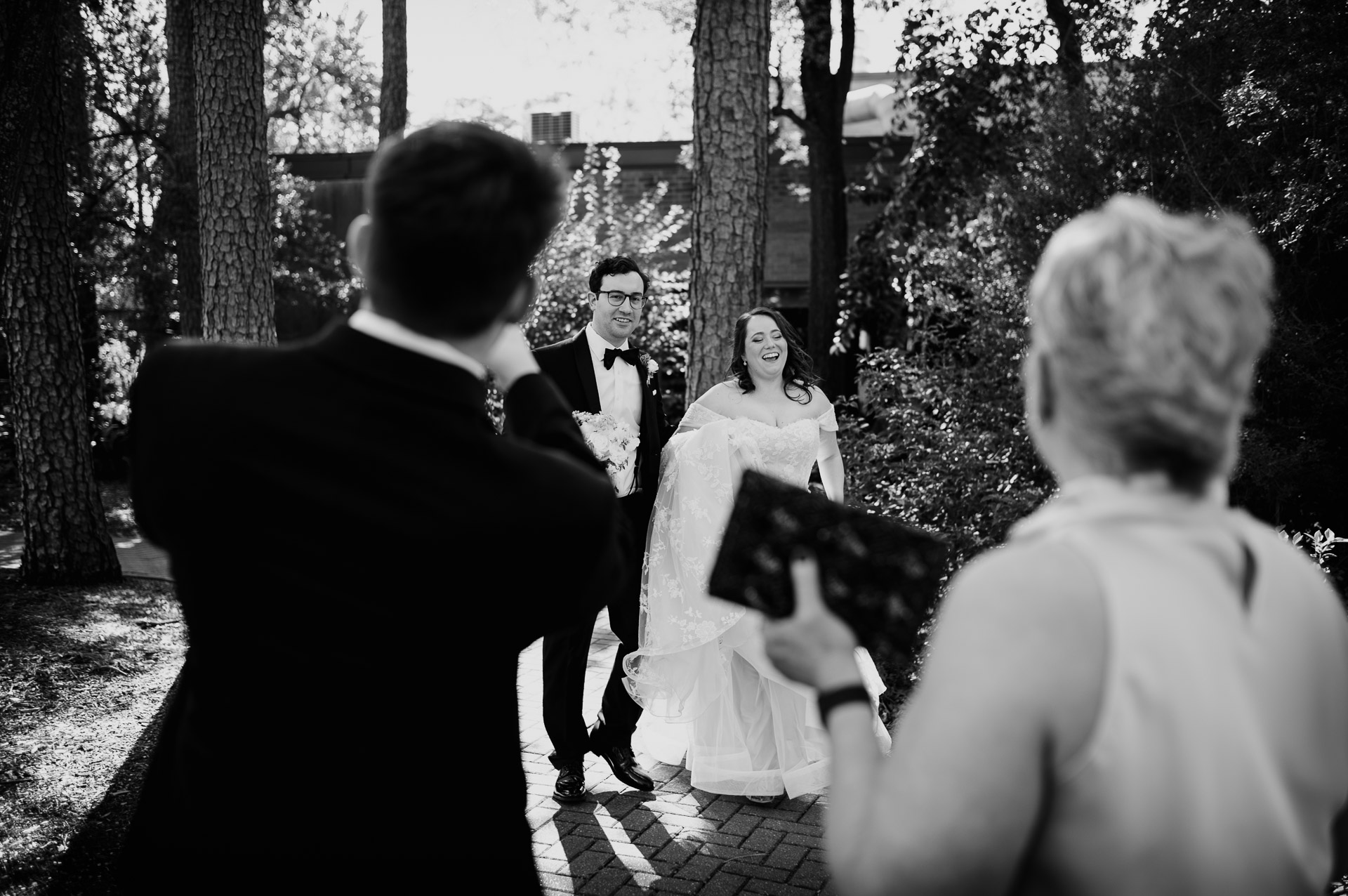 Oak Tree Ceremony & Candlelit Reception at The Houstonian 13 Outdoor ceremony photographed from behind a guest at The Houstonian Hotel.