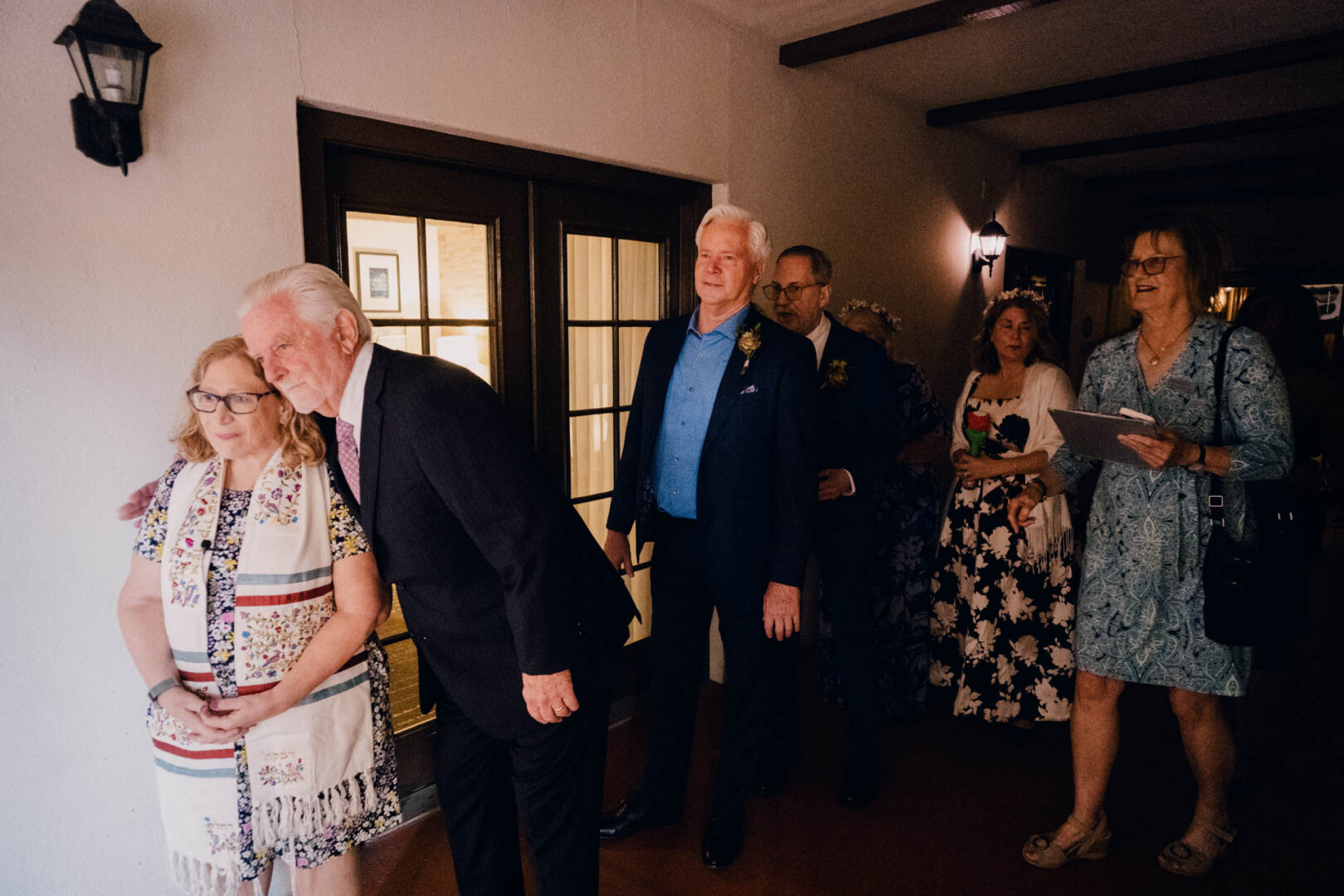 Wedding guests arriving indoors at Omni La Mansión del Rio in San Antonio