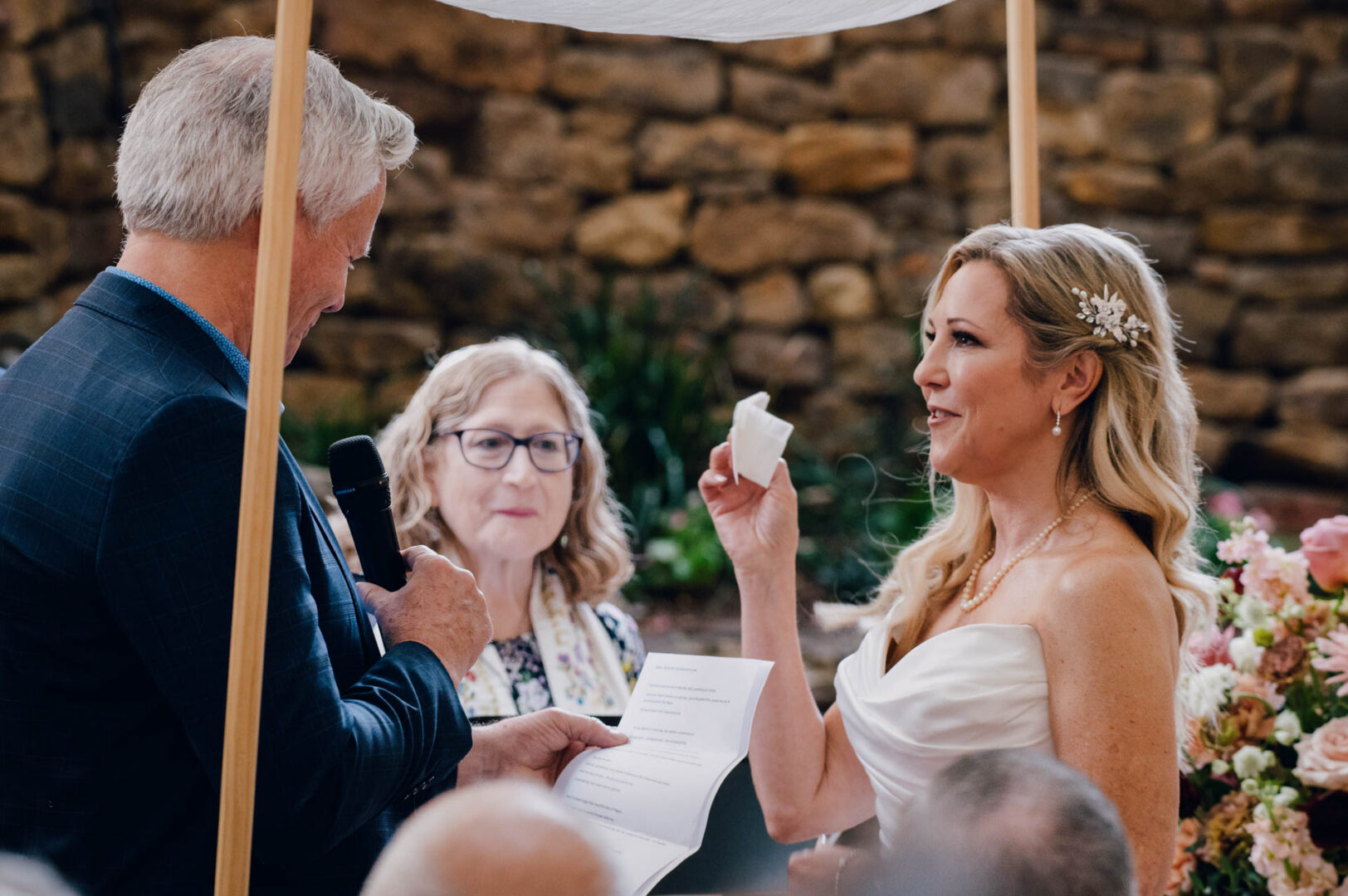 Bride takes out vows from cleavage - Wedding ceremony kiss in the courtyard