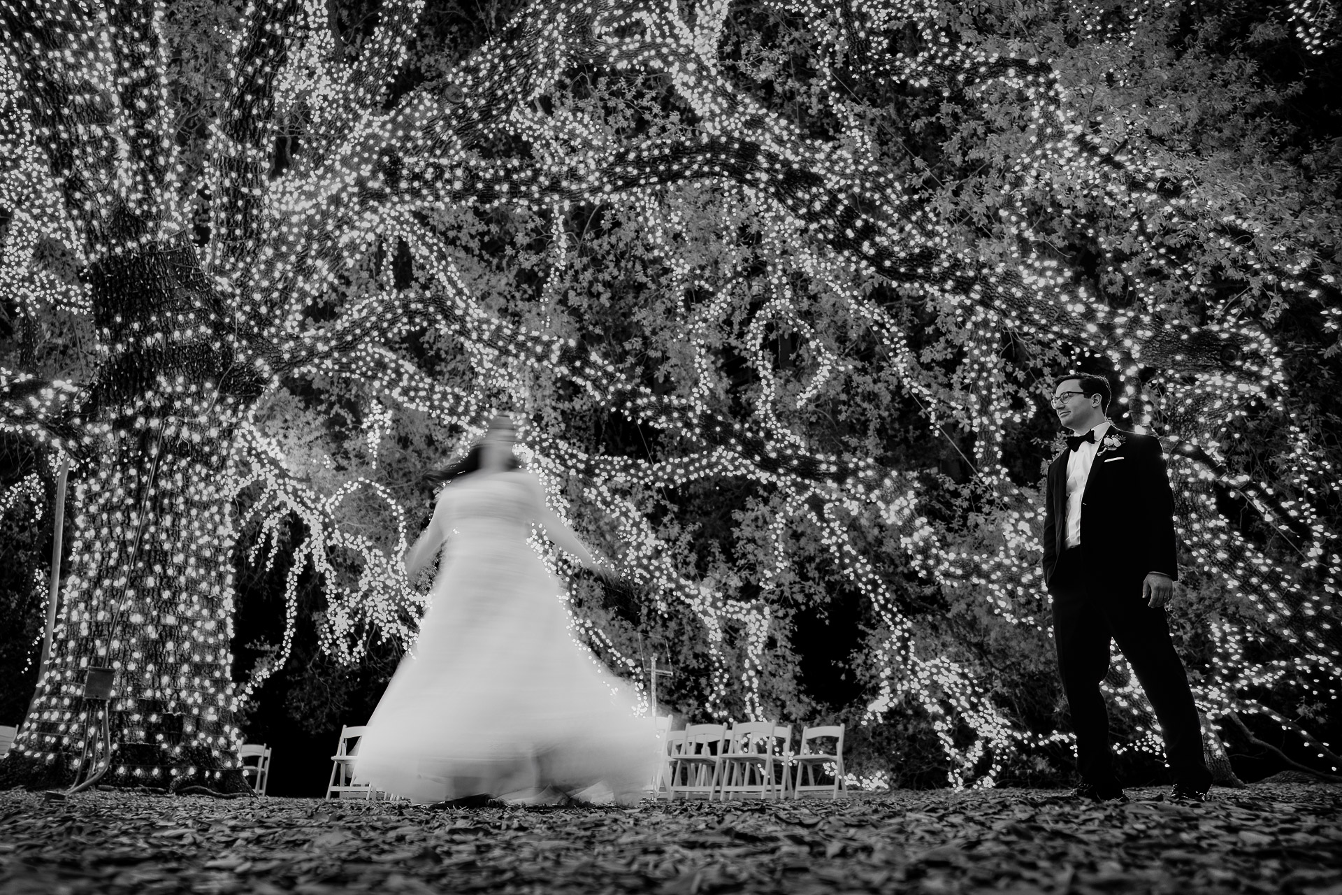 Oak Tree Ceremony & Candlelit Reception at The Houstonian 36 Bride and groom dancing together under the famous oak tree at The Houstonian Hotel.