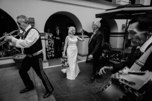 Omni La Mansión del Rio Wedding | Leica SL3-S Documentary Photography 42 Mariachi musicians performing during wedding reception in the courtyard at Omni La Mansión del Rio