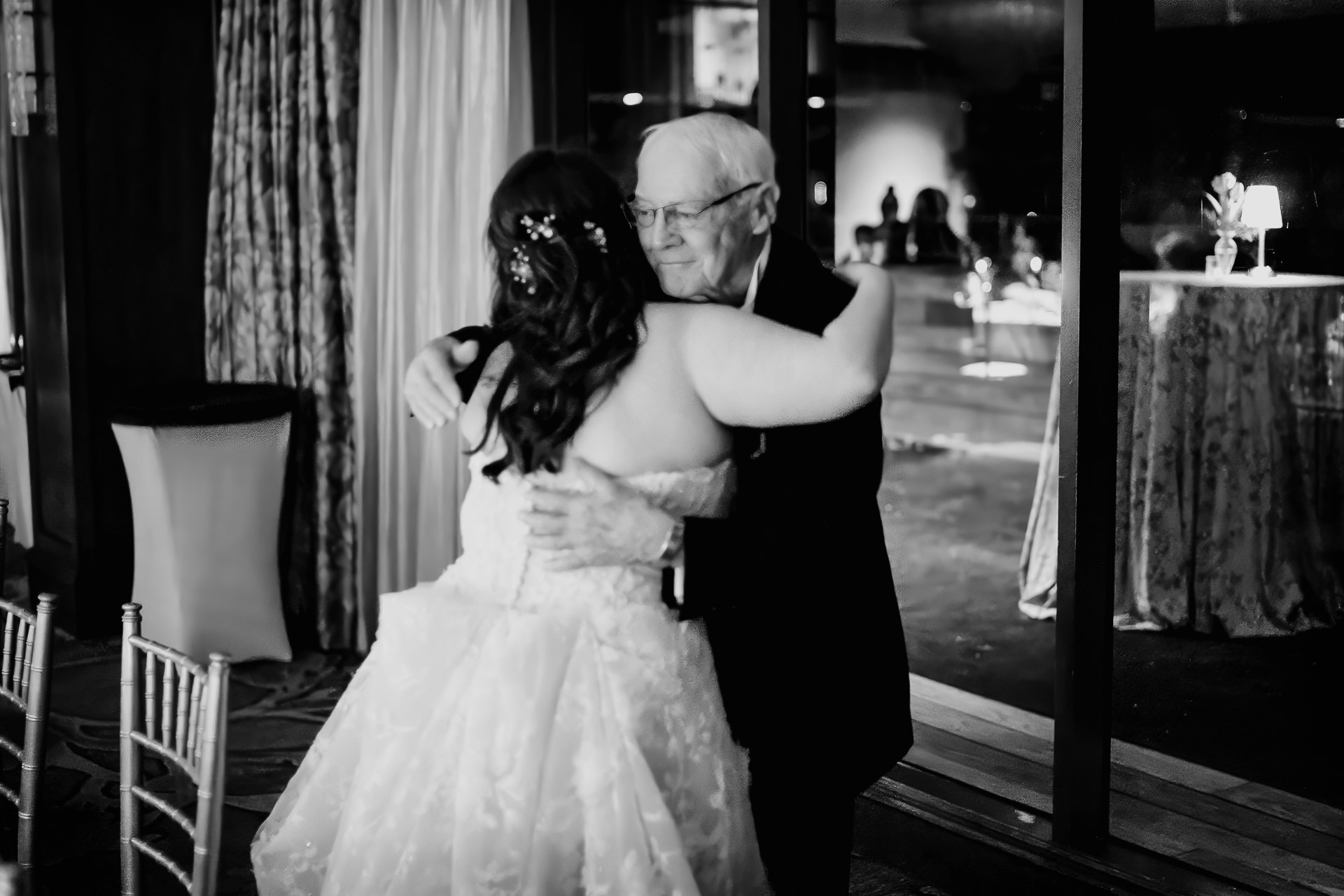 Oak Tree Ceremony & Candlelit Reception at The Houstonian 45 A grandparent hugs his granddaughter bride at Houstonian Hotel wedding
