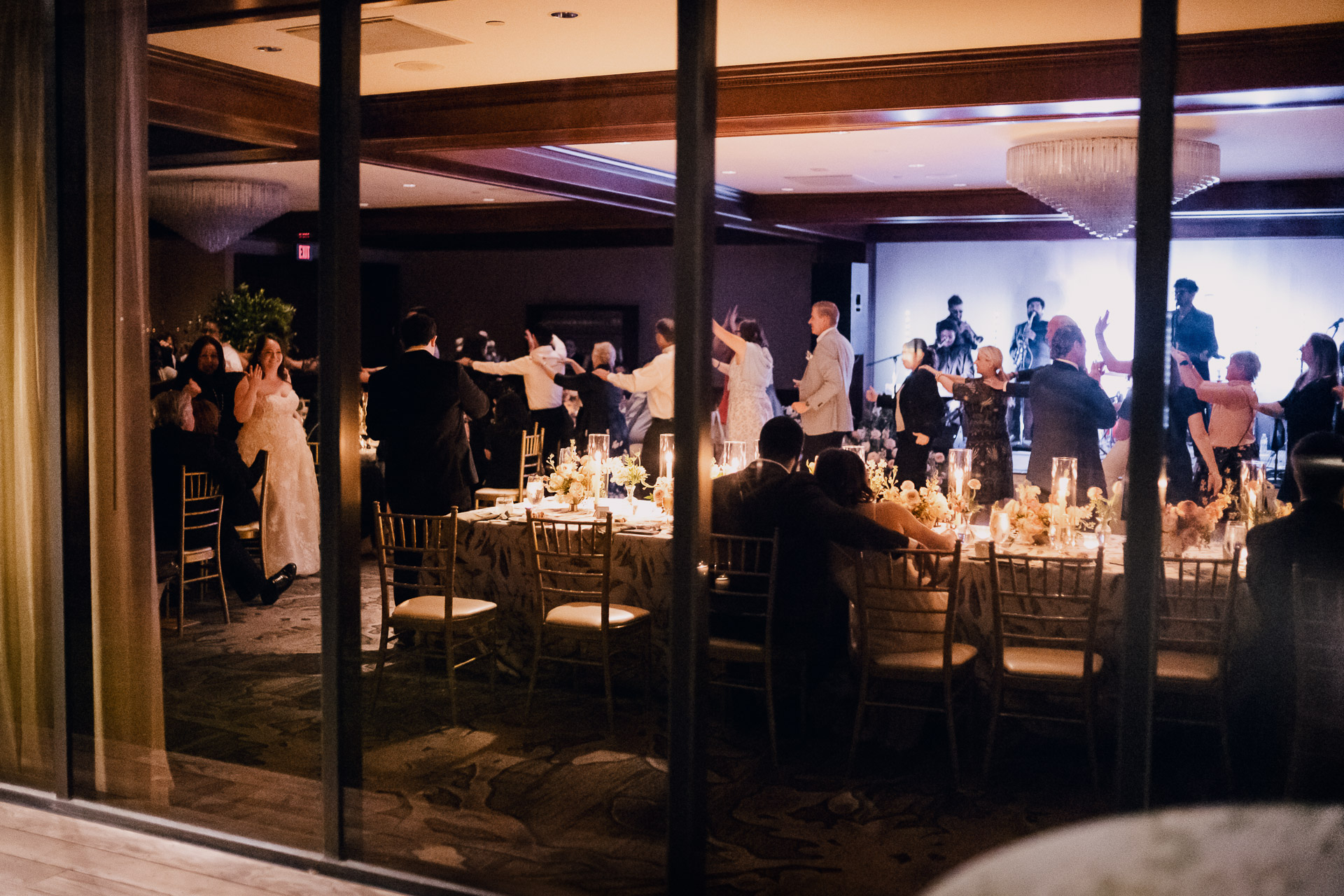 Oak Tree Ceremony & Candlelit Reception at The Houstonian 50 Houstonian Hotel wedding guests creating a train with bride leading the way