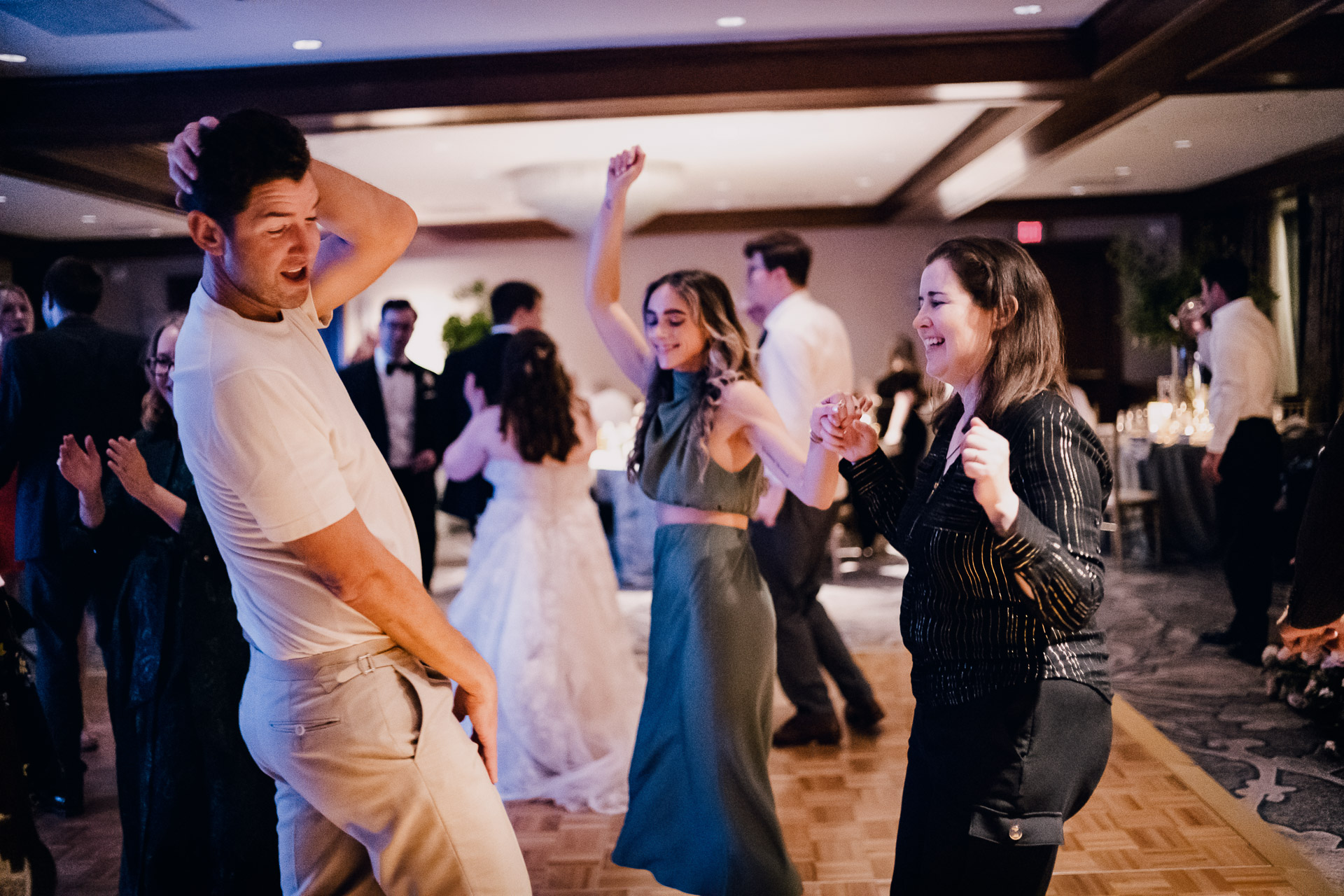 Oak Tree Ceremony & Candlelit Reception at The Houstonian 51 People dancing at a wedding reception.