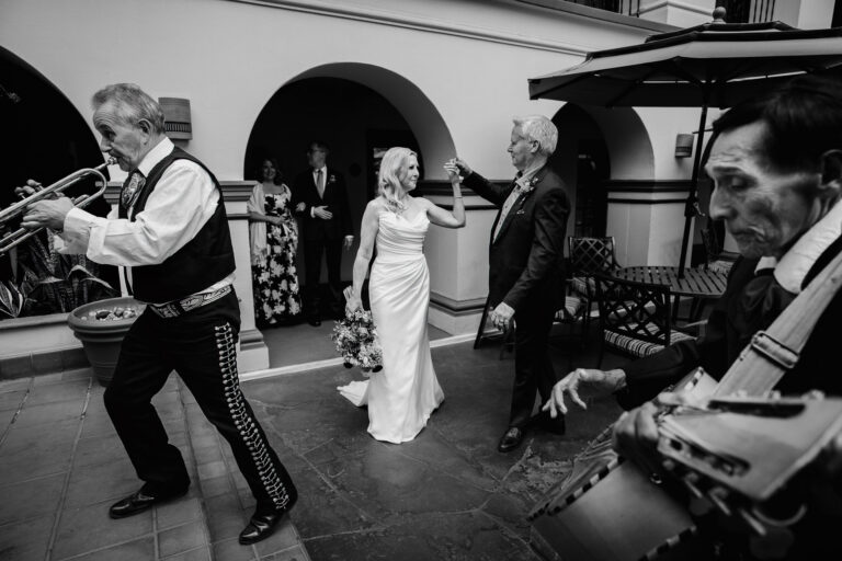 Mariachi musicians performing during wedding reception in the courtyard at Omni La Mansión del Rio by San Antonio photographer Philip Thomas