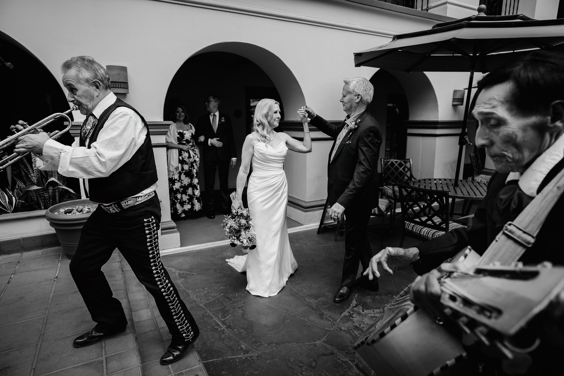 Mariachi musicians performing during wedding reception in the courtyard at Omni La Mansión del Rio by San Antonio photographer Philip Thomas