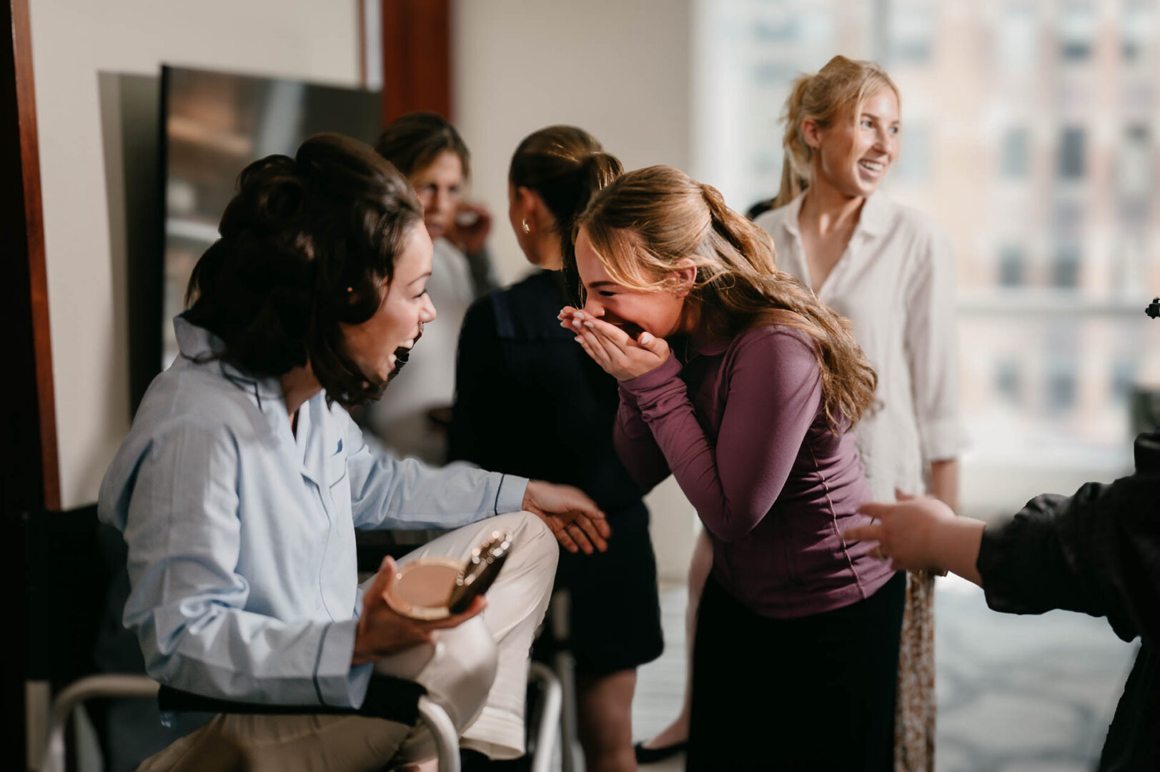 Emotional greeting between family members during bridal preparations.