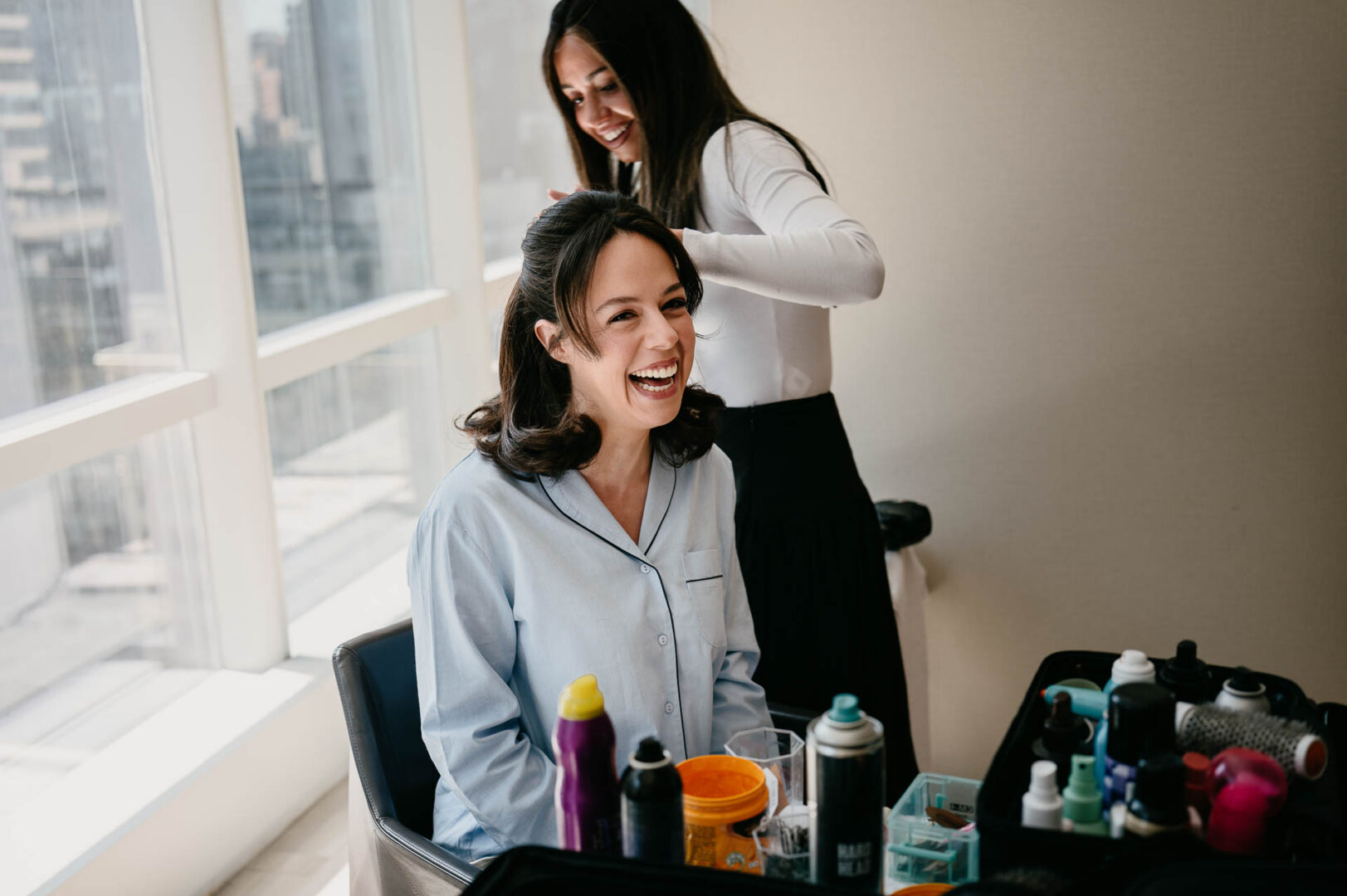 Bride smiling during preparations before her Metropolitan Club wedding.