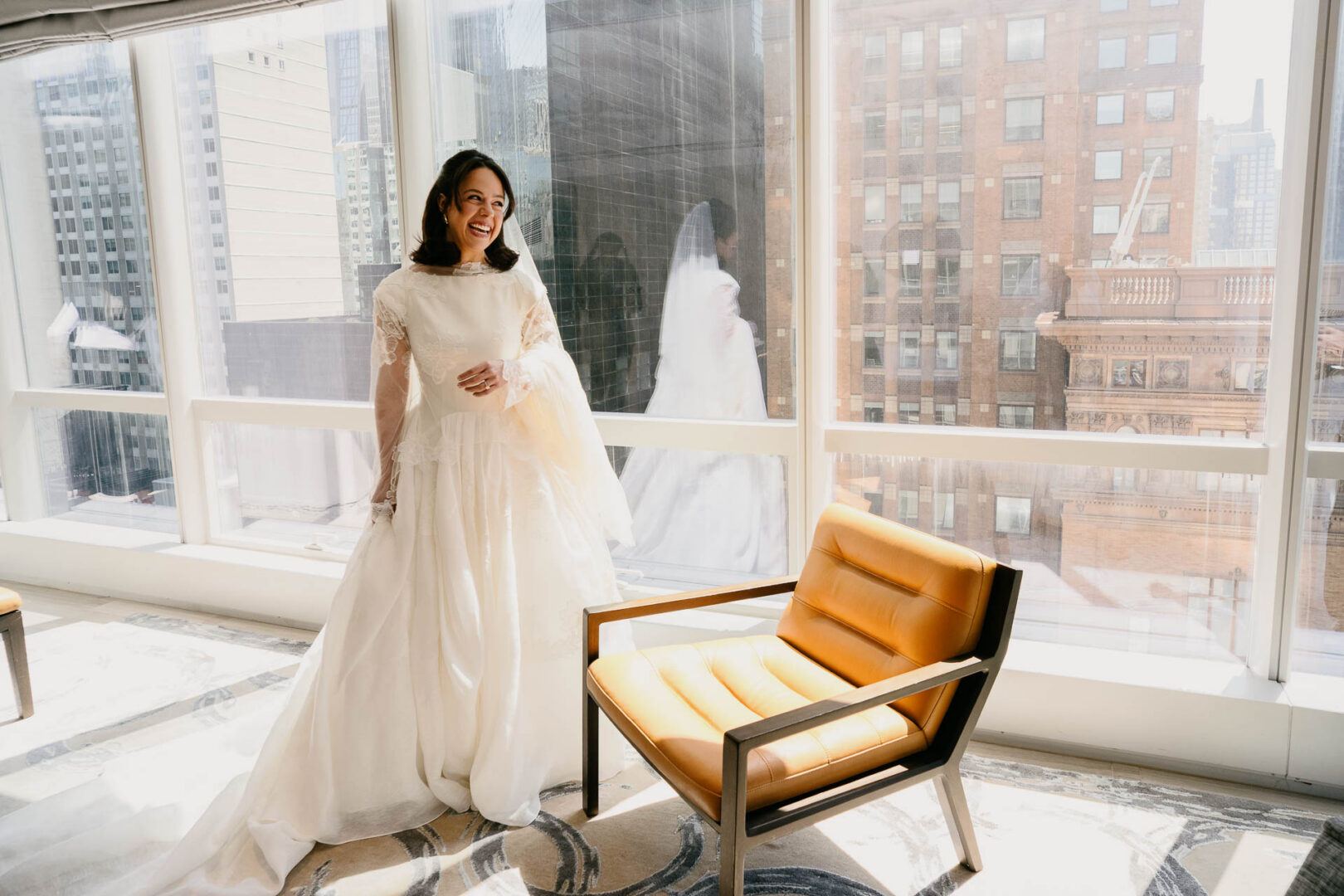 Bride walking past a window during preparations at the Park Hyatt.