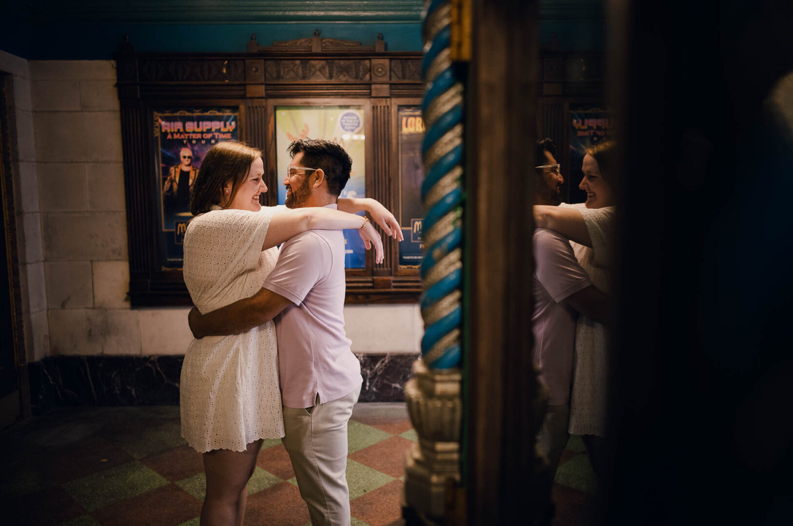 Couple embracing in a vintage setting.