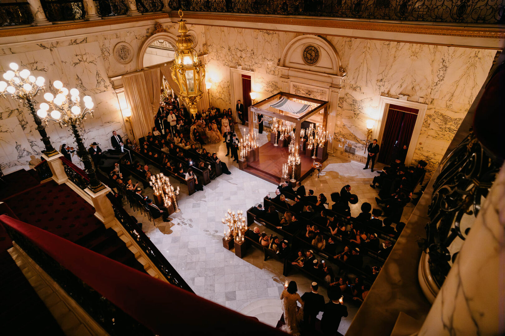 Overhead photograph of guests gathered for the wedding ceremony.