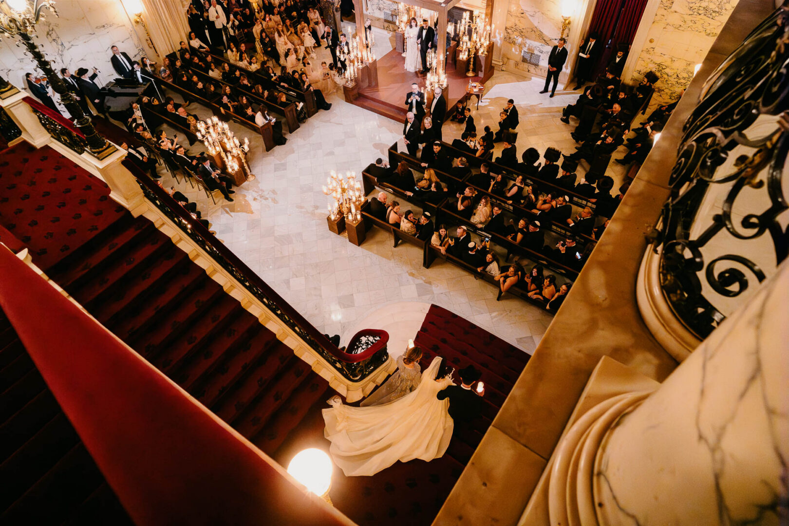 Overhead photograph of the Orthodox Jewish wedding ceremony and seated guests.