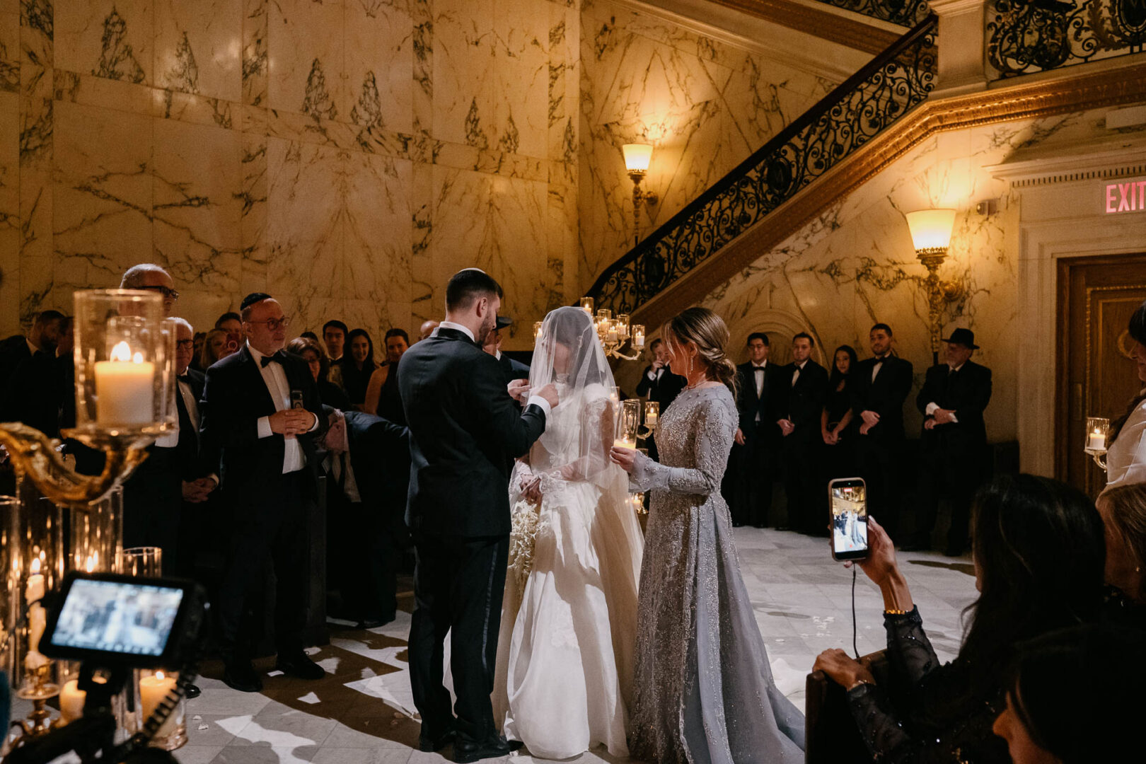 Bride and groom during the ceremony in the historic Metropolitan Club ballroom.
