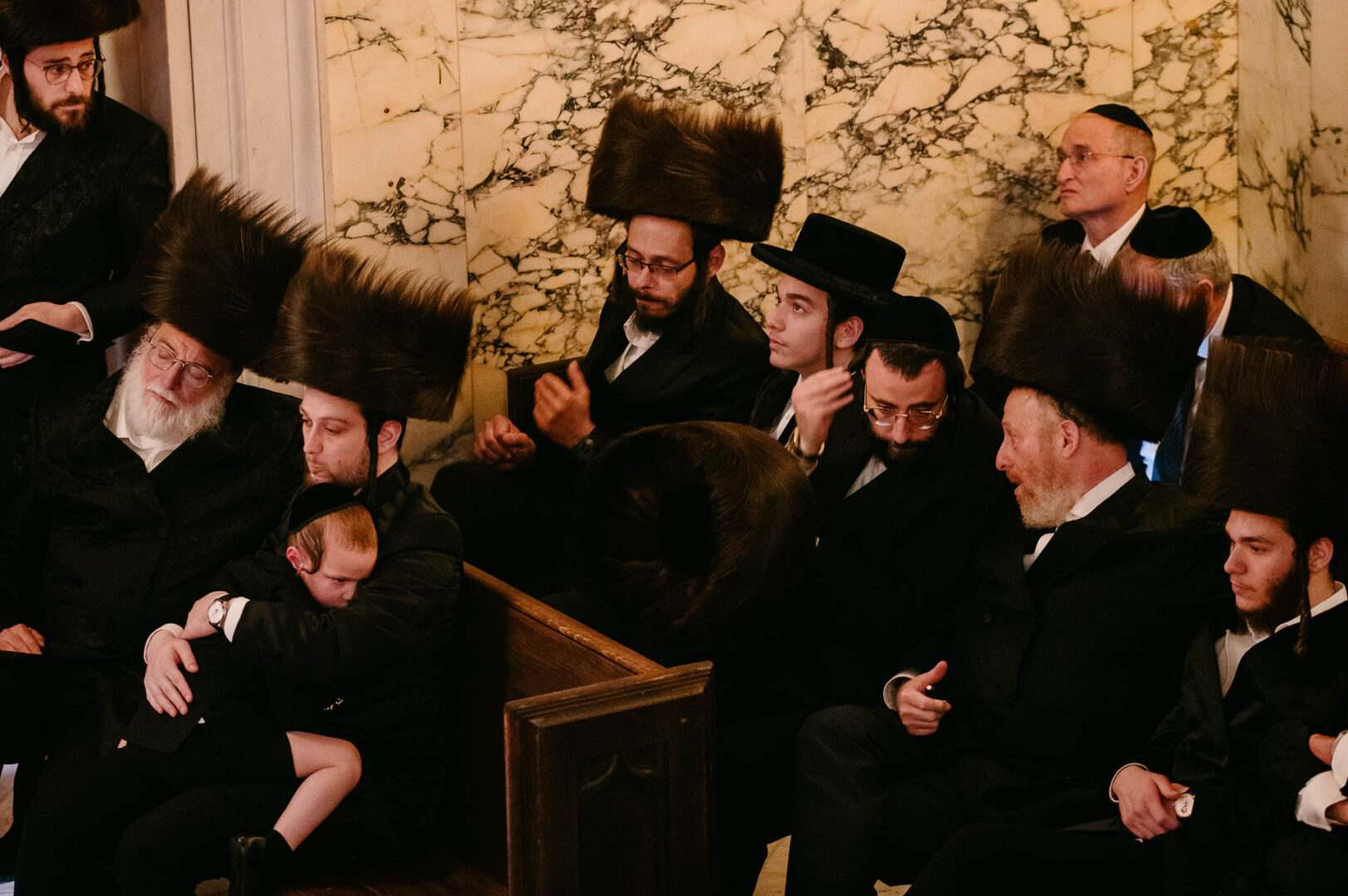 Hasidic wedding guests gathered closely during the ceremony.