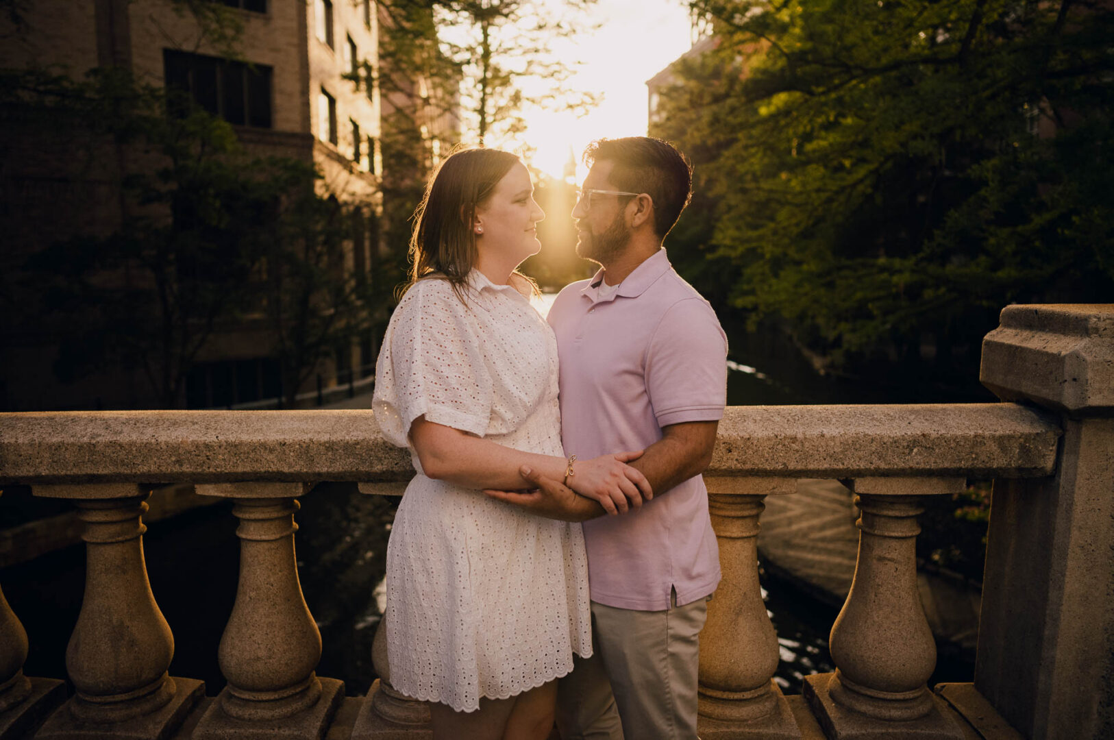 Couple embracing during sunset.