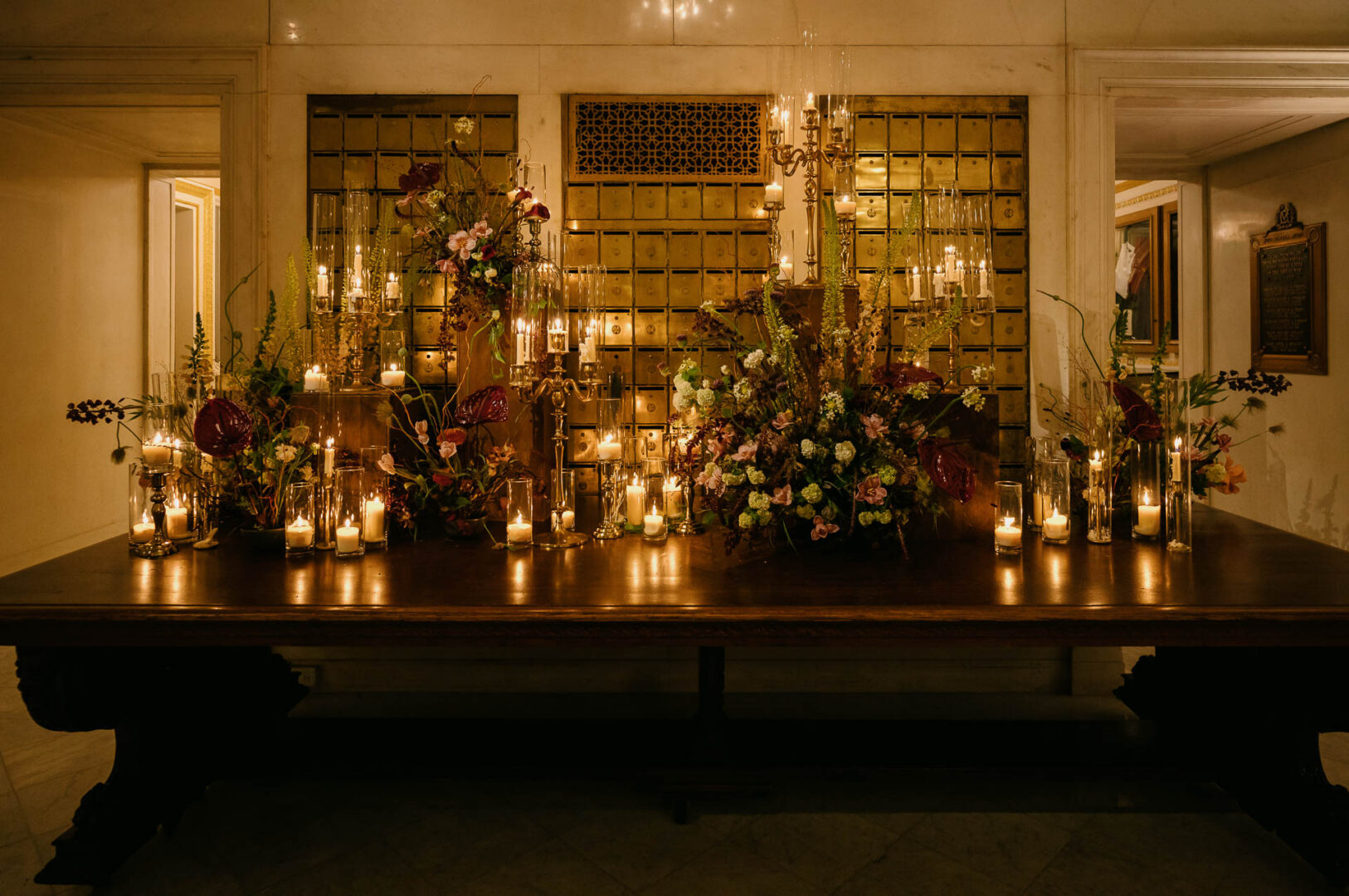 Elegant floral arrangement with candles.