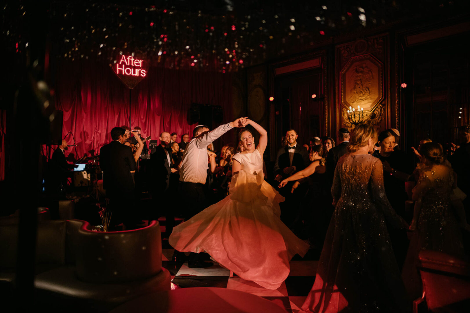 Couple dancing at a lively wedding