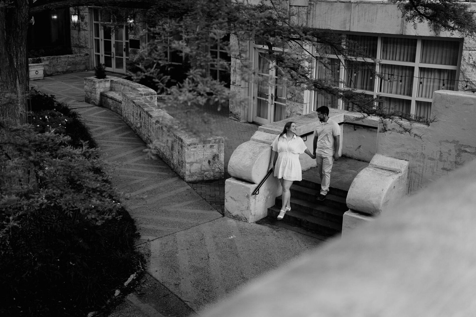Couple walking down outdoor steps.
