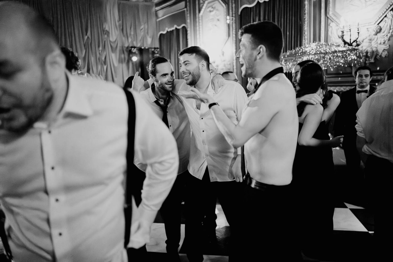 Men socializing at a wedding reception.
