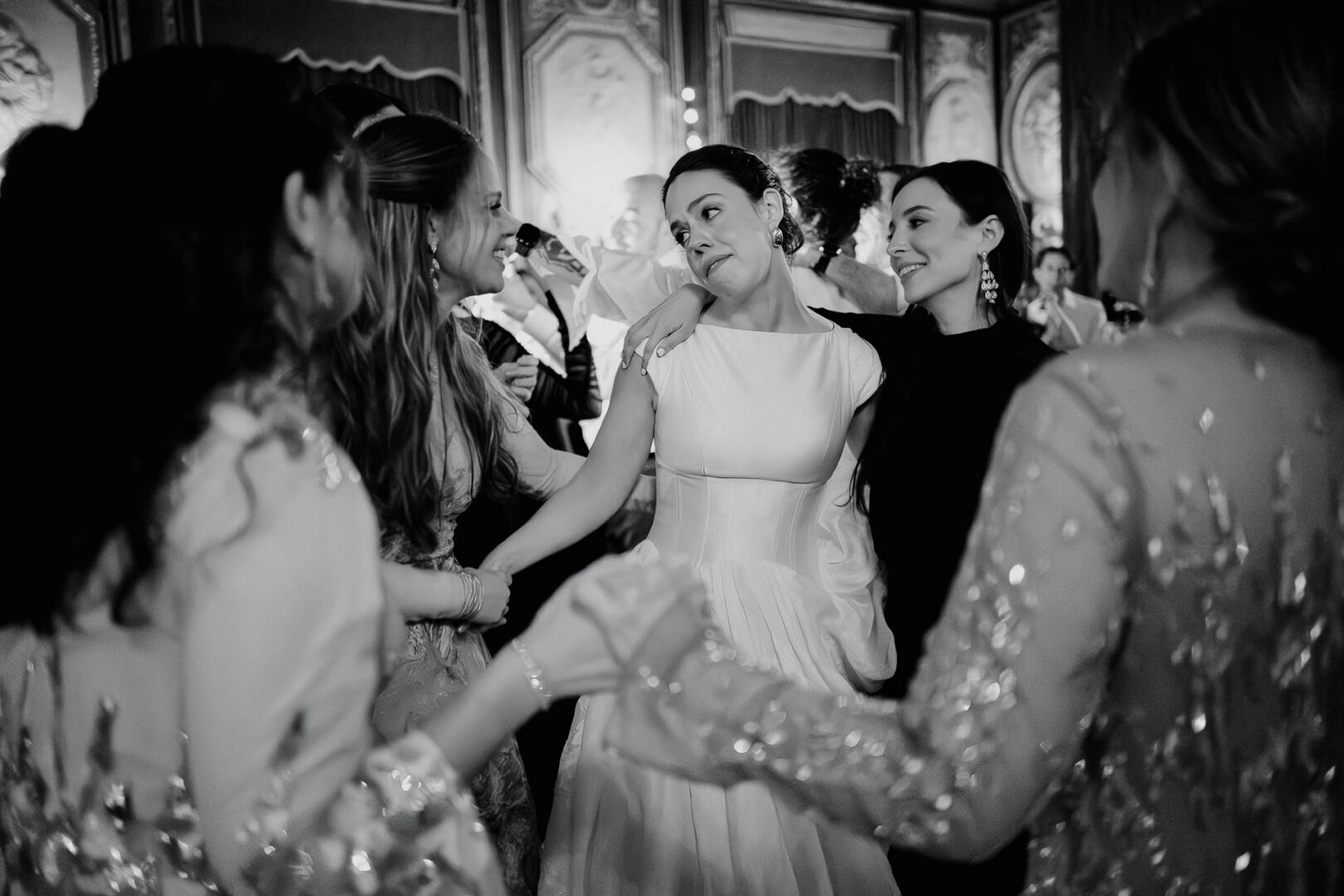 Women celebrating at a wedding reception.