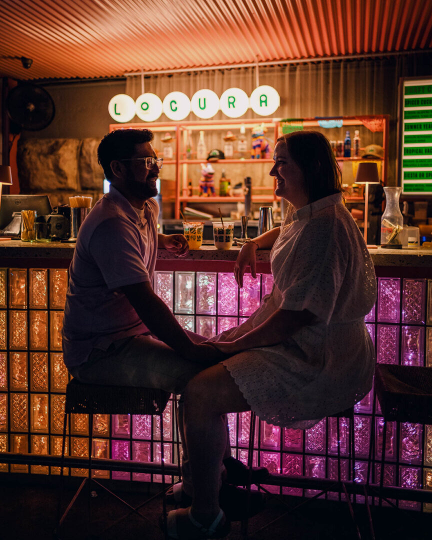 Couple enjoying drinks at Locura bar San Antonio