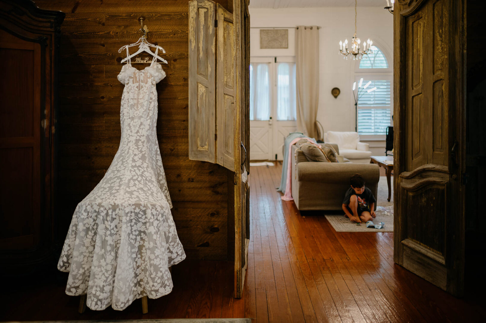 Wedding dress hanging inside a historic room at The Kendall.