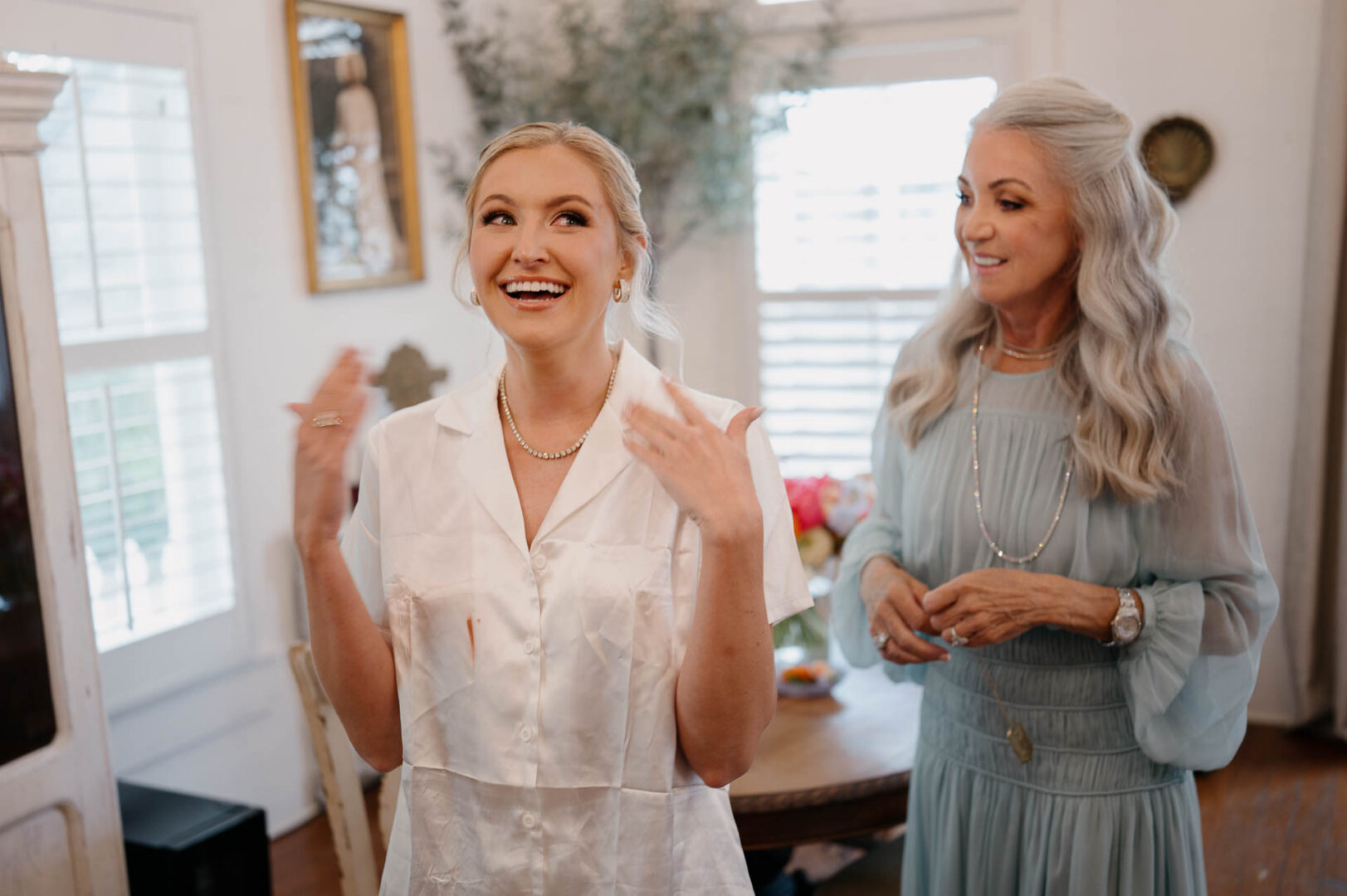 Bride laughing while getting ready with bridesmaids at The Kendall.