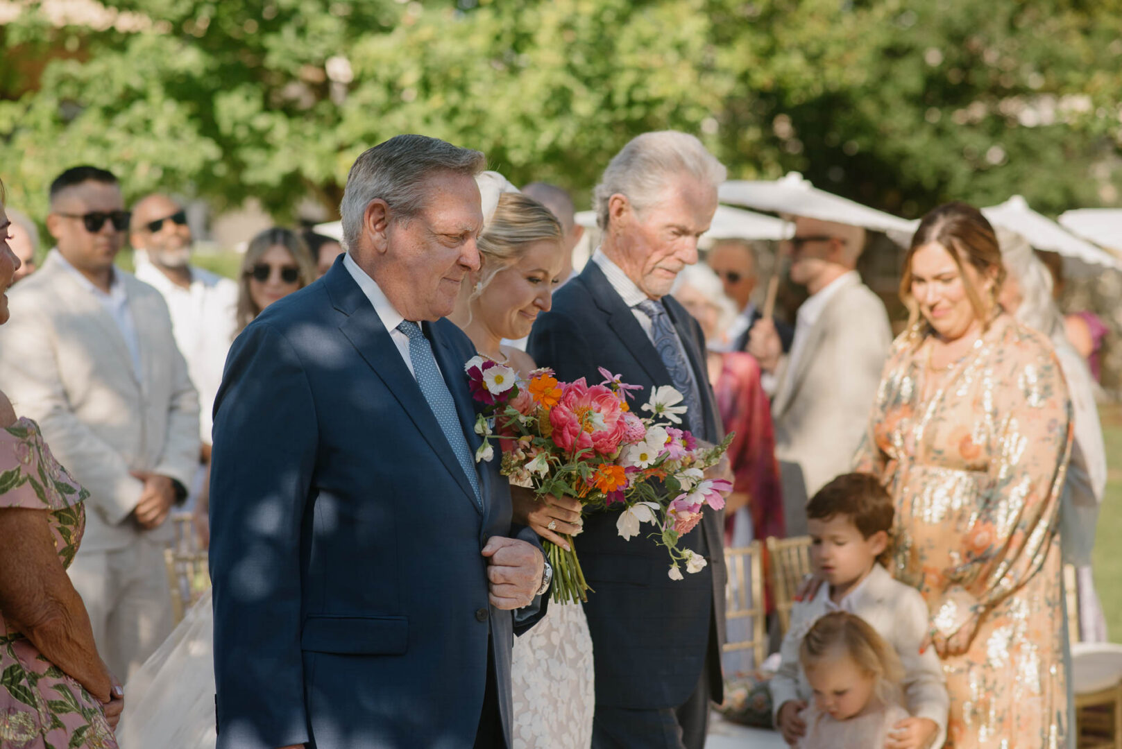 Wedding party members gathered during the outdoor ceremony at The Kendall.