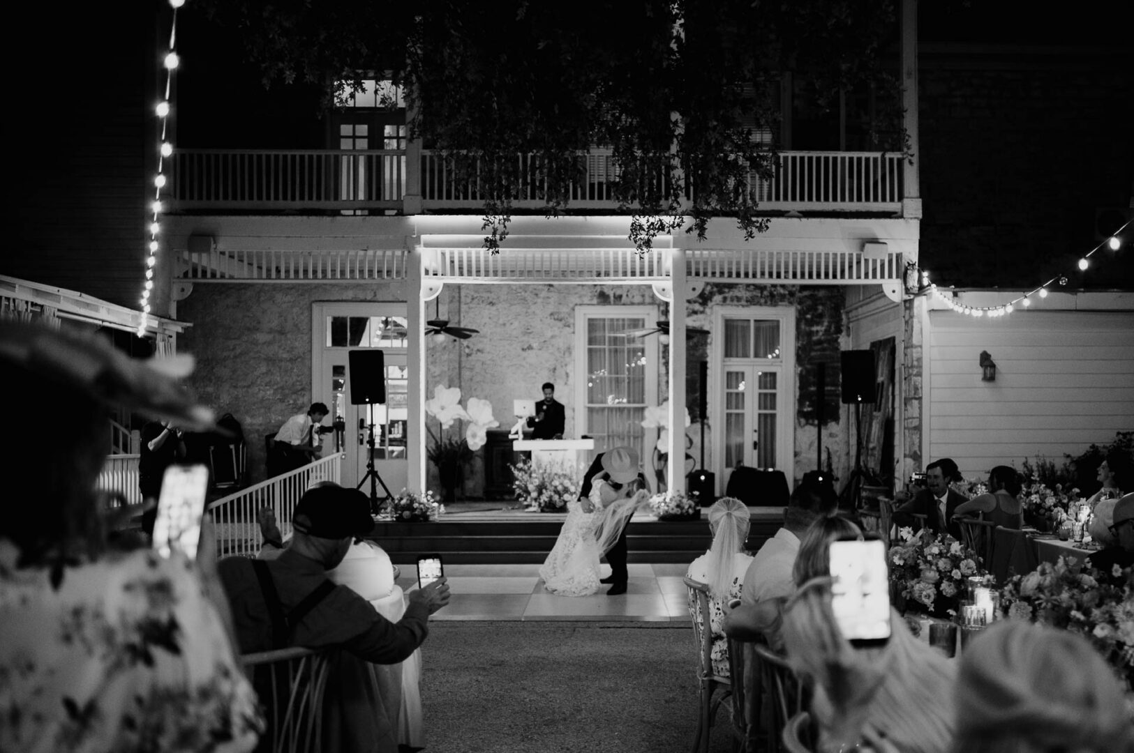 Couple dancing together outside The Kendall during the wedding reception.