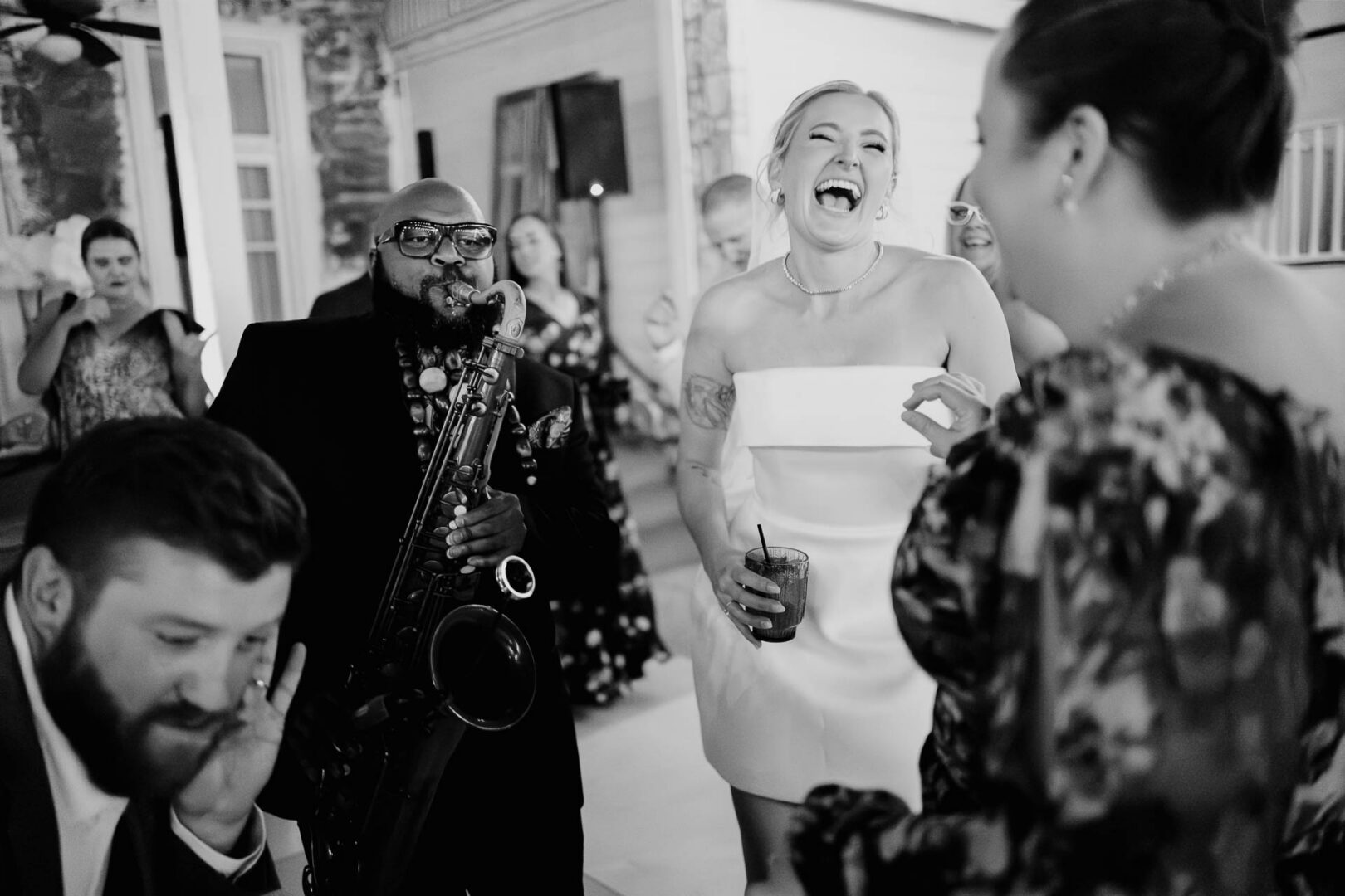 Bride laughing with guests during the reception at The Kendall.
