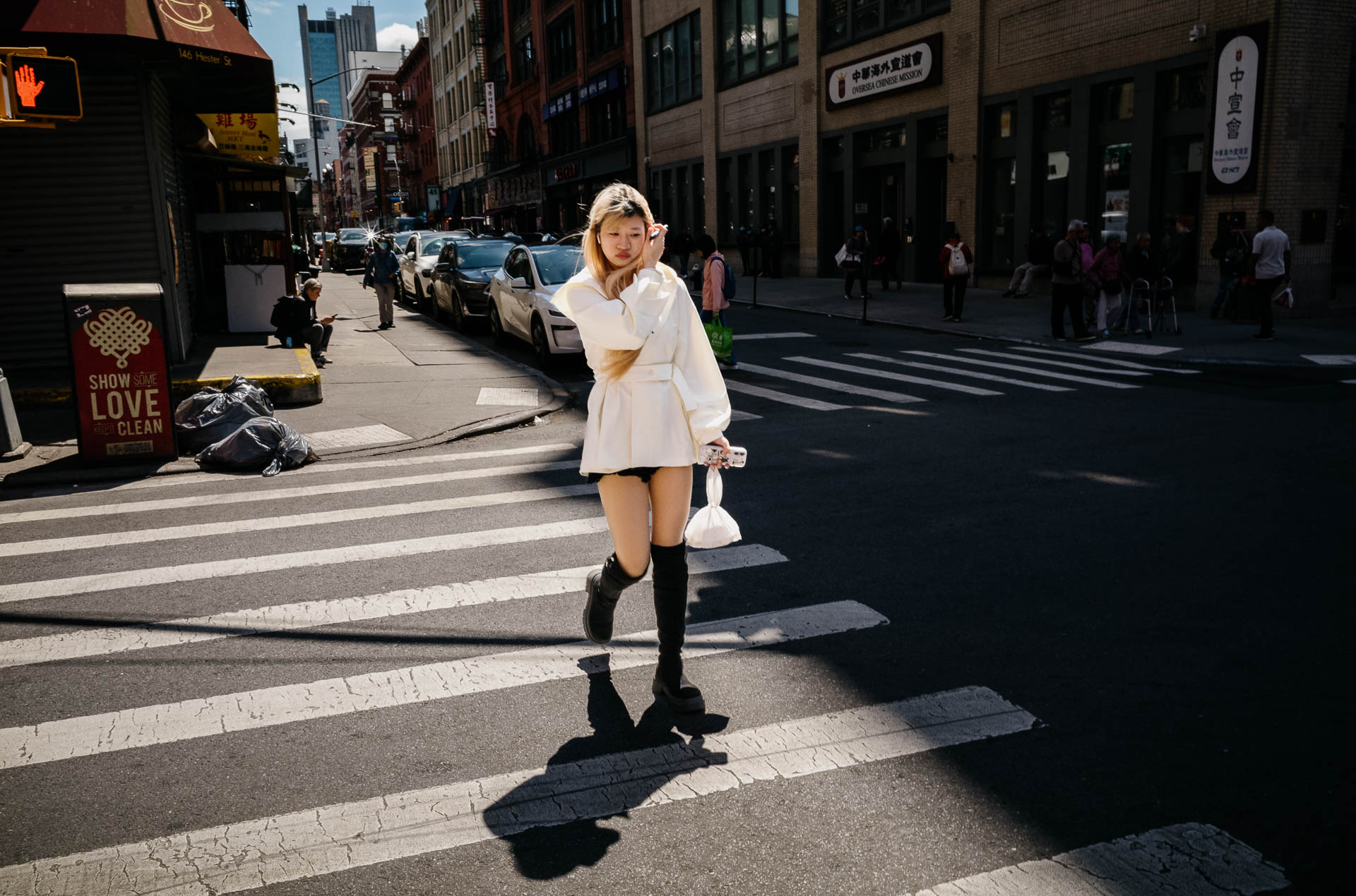Real Wedding Stories & Photo Inspiration | Philip Thomas Photo Blog 24 A pedestrian crosses Hester Street through a patch of afternoon light during a May walk through New York City.
