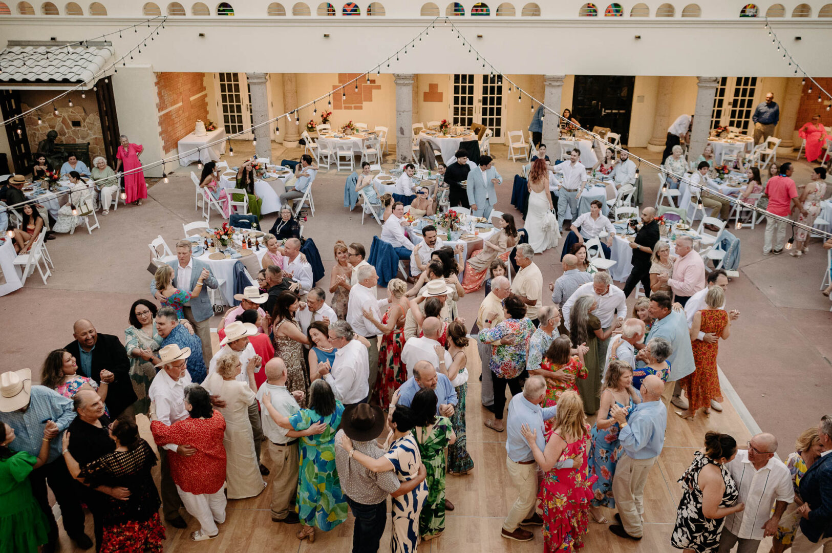 Chapel on the Dunes Wedding | Port Aransas, Texas | Mady+Roland 58 Crowded wedding reception with dancing guests.