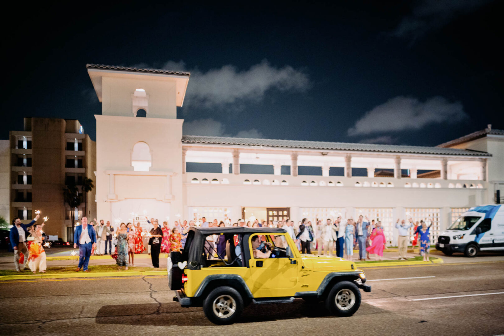 Chapel on the Dunes Wedding | Port Aransas, Texas | Mady+Roland 80 Yellow jeep driving past wedding guests