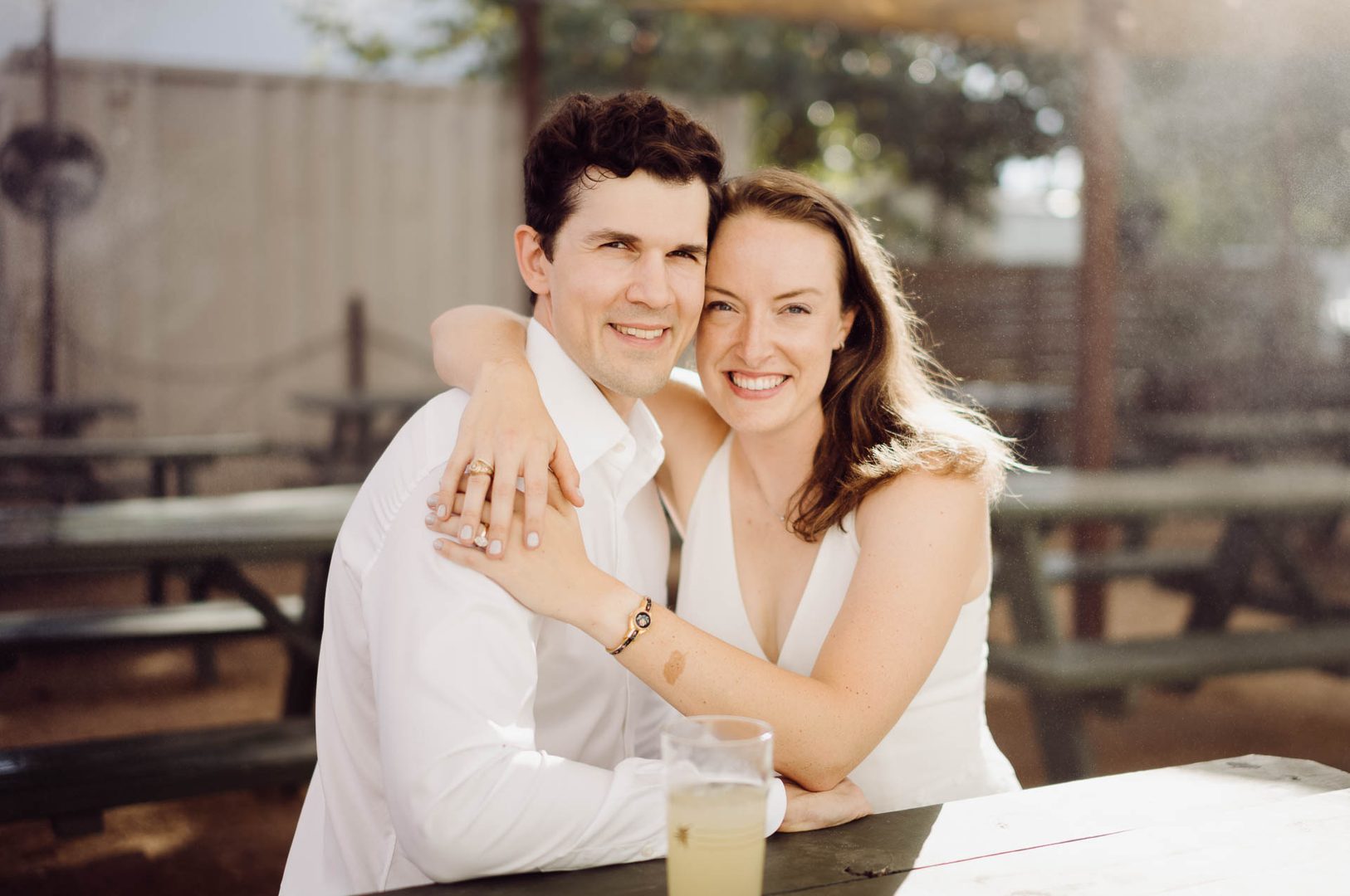 Couple smiling at outdoor table