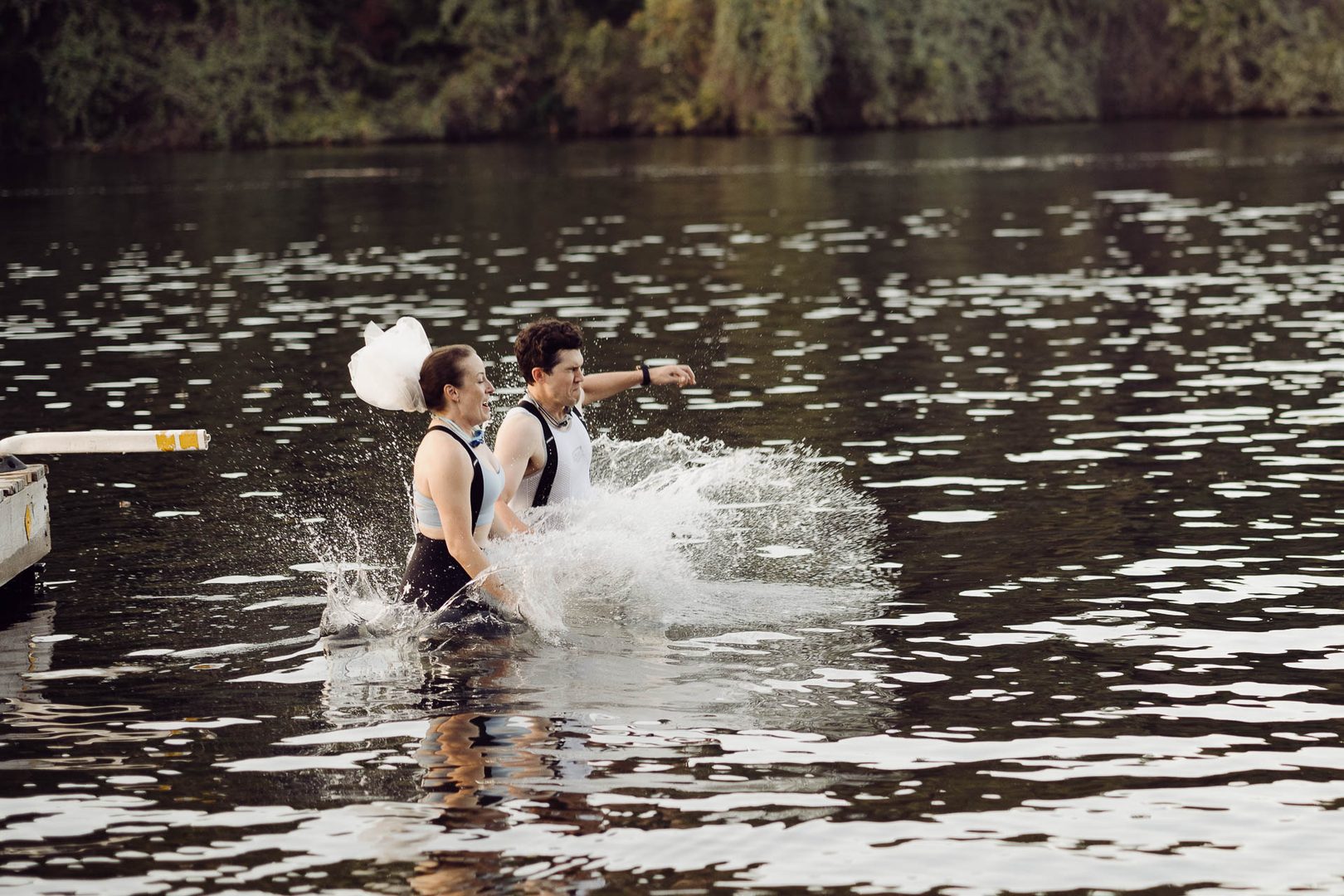 Couple splashing in water together