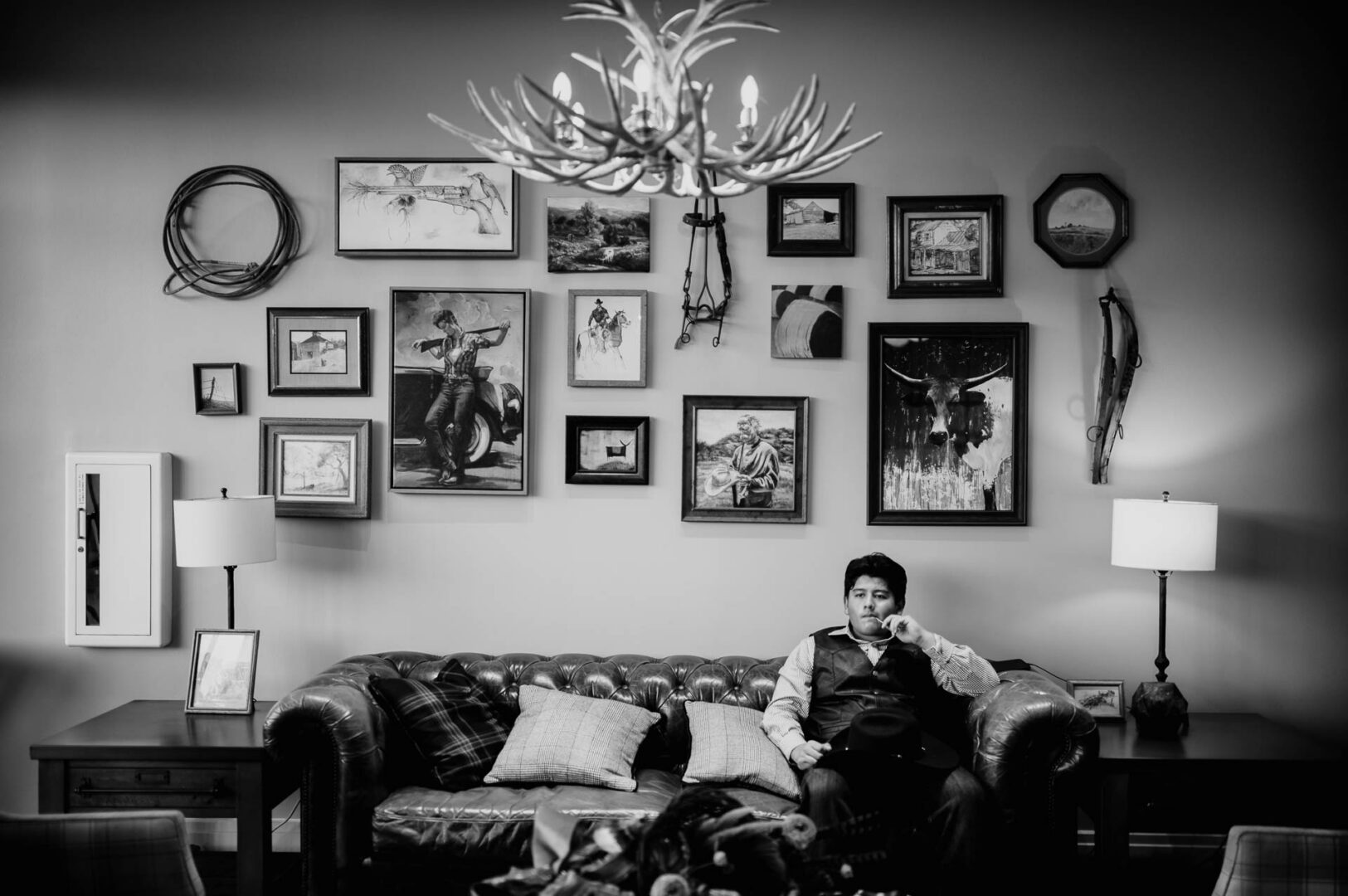 Tapatio Springs Hill Country Resort | Luana + Mack | Helotes 31 Man sitting on couch, art gallery wall