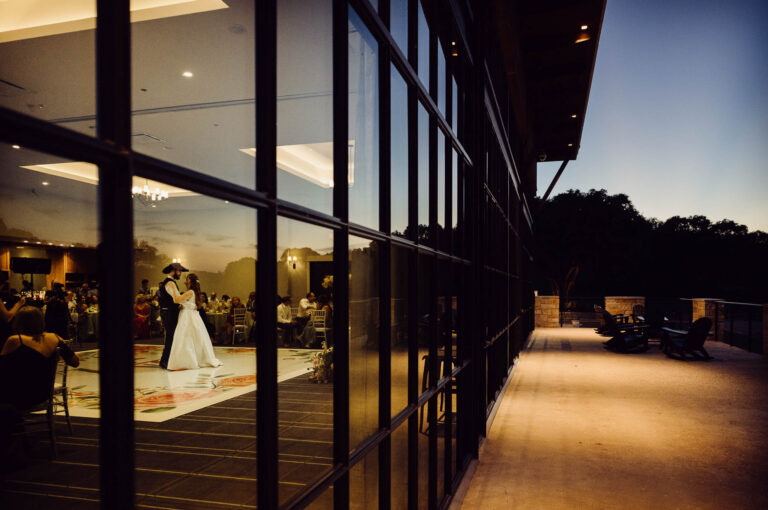 Couple dancing at sunset wedding reception at Tapatio Springs Hill Country Resort