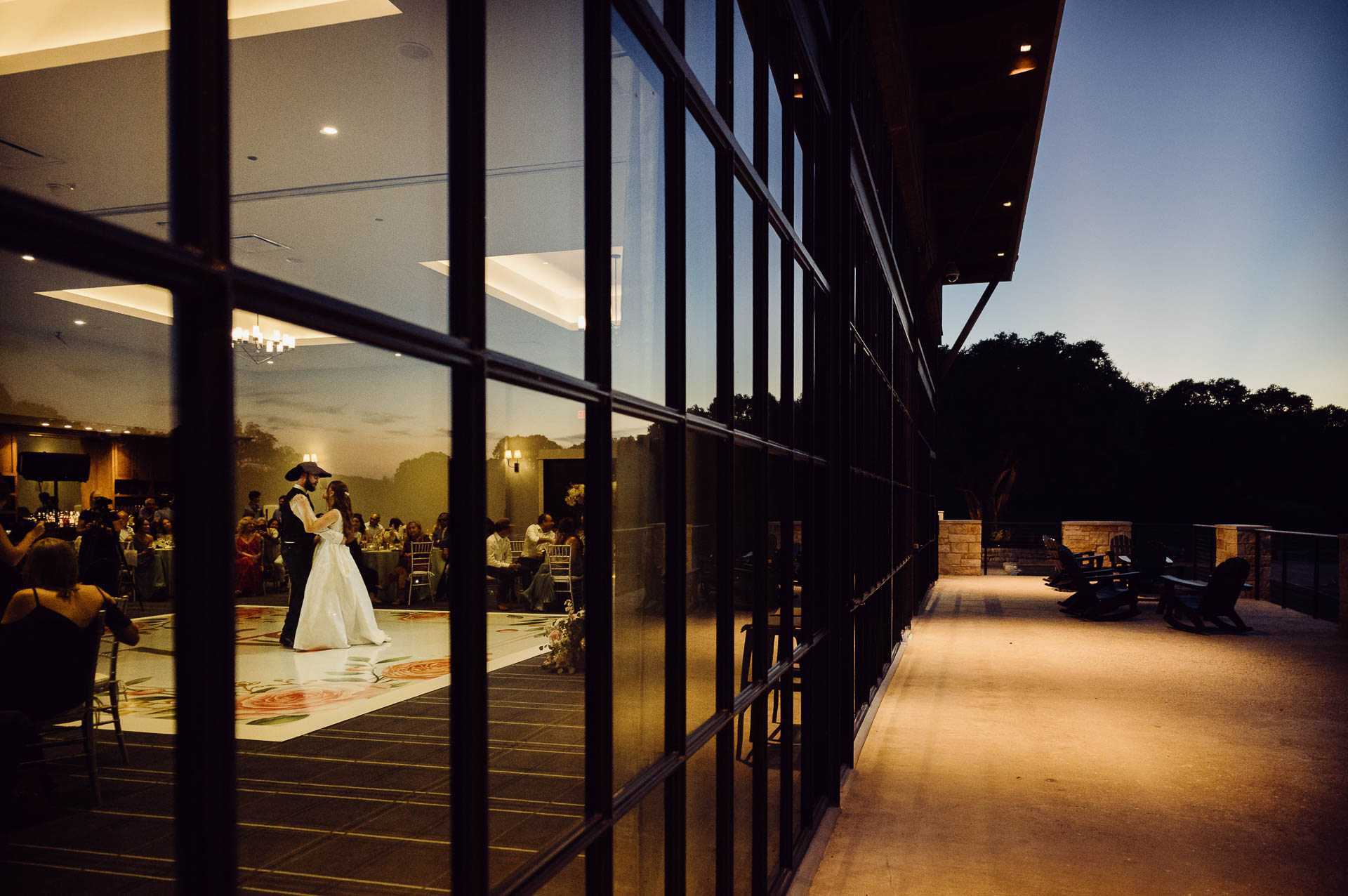 Couple dancing at sunset wedding reception at Tapatio Springs Hill Country Resort