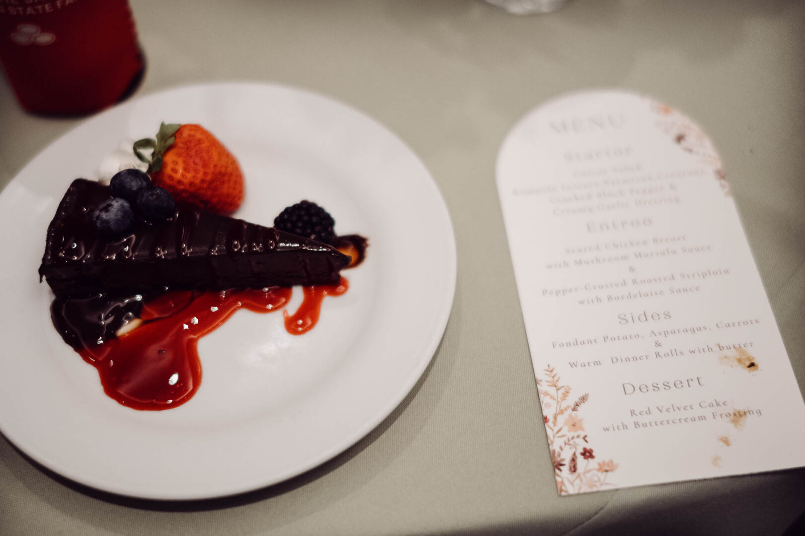 Tapatio Springs Hill Country Resort | Luana + Mack | Helotes 42 Chocolate cake with berries and menu