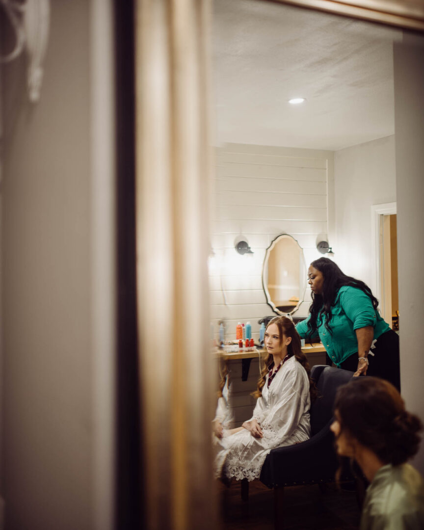 Tapatio Springs Hill Country Resort | Luana + Mack | Helotes 2 Bridal preparation in a mirror reflection at Tapatio-Springs-Hill-Country